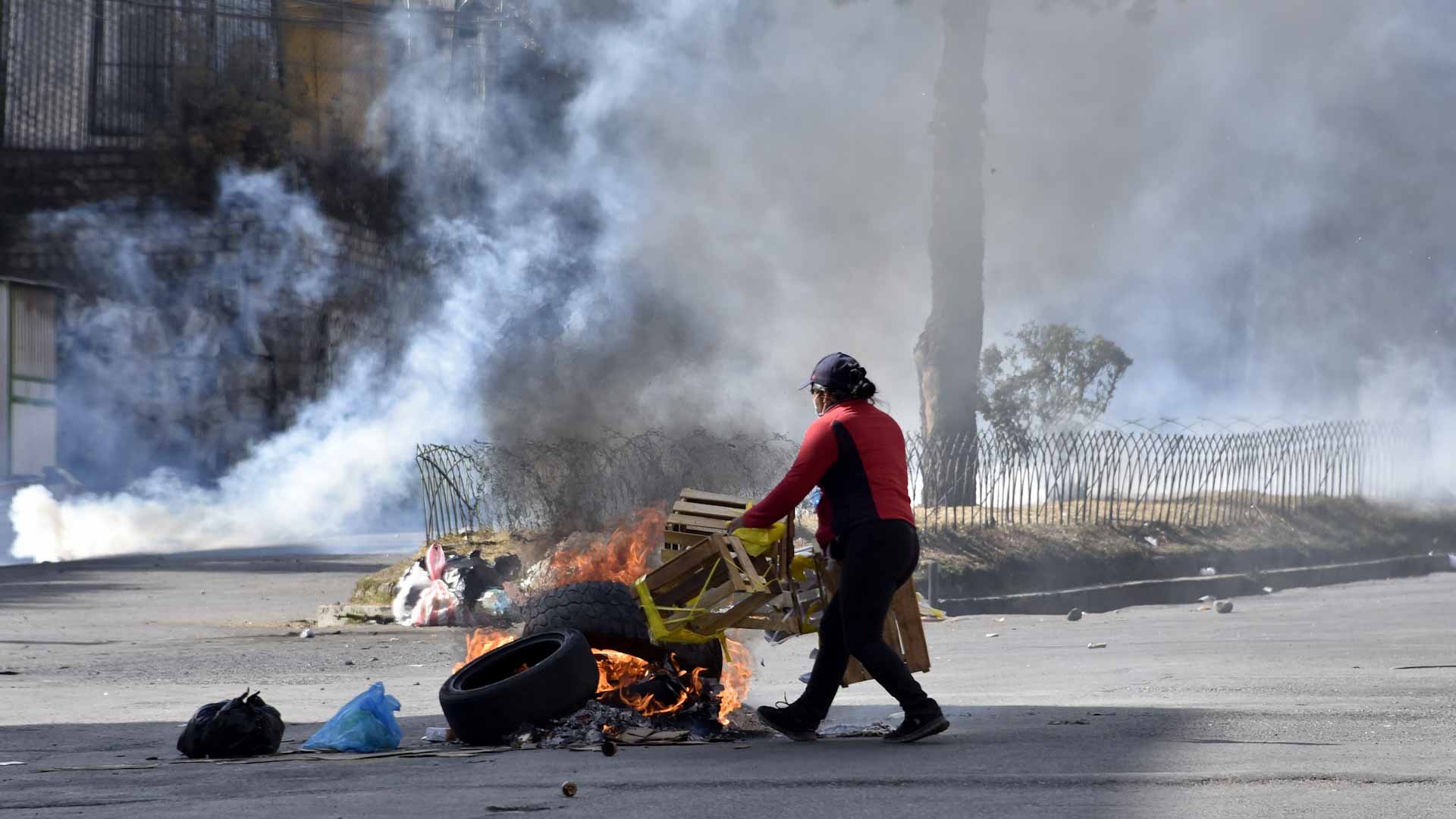 Image for the title: Clashes erupt in Bolivia capital between police and coca farmers 