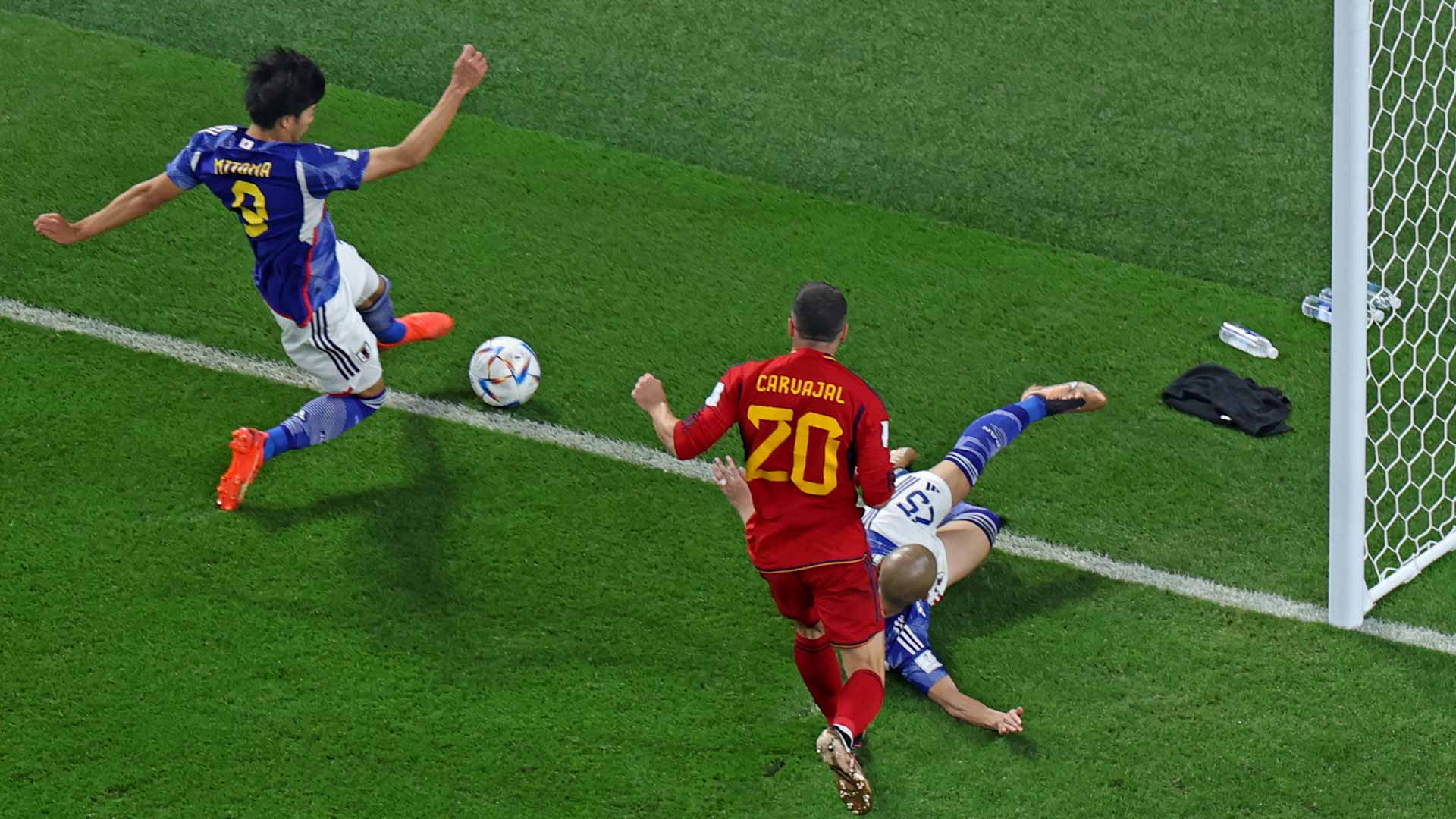 Image for the title: Japan shocks Spain, but both reach World Cup last 16 