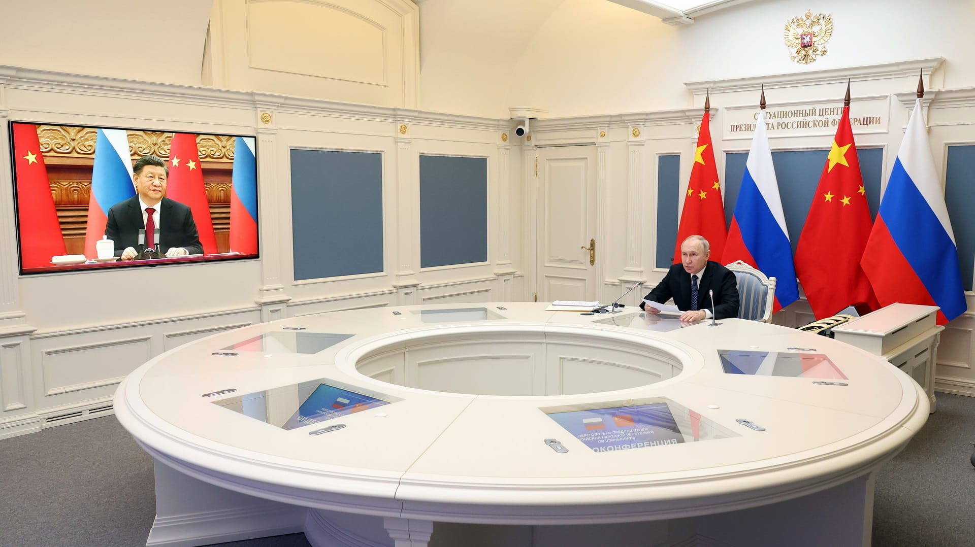 Image for the title: Putin tells Xi he wants to ramp up military cooperation 