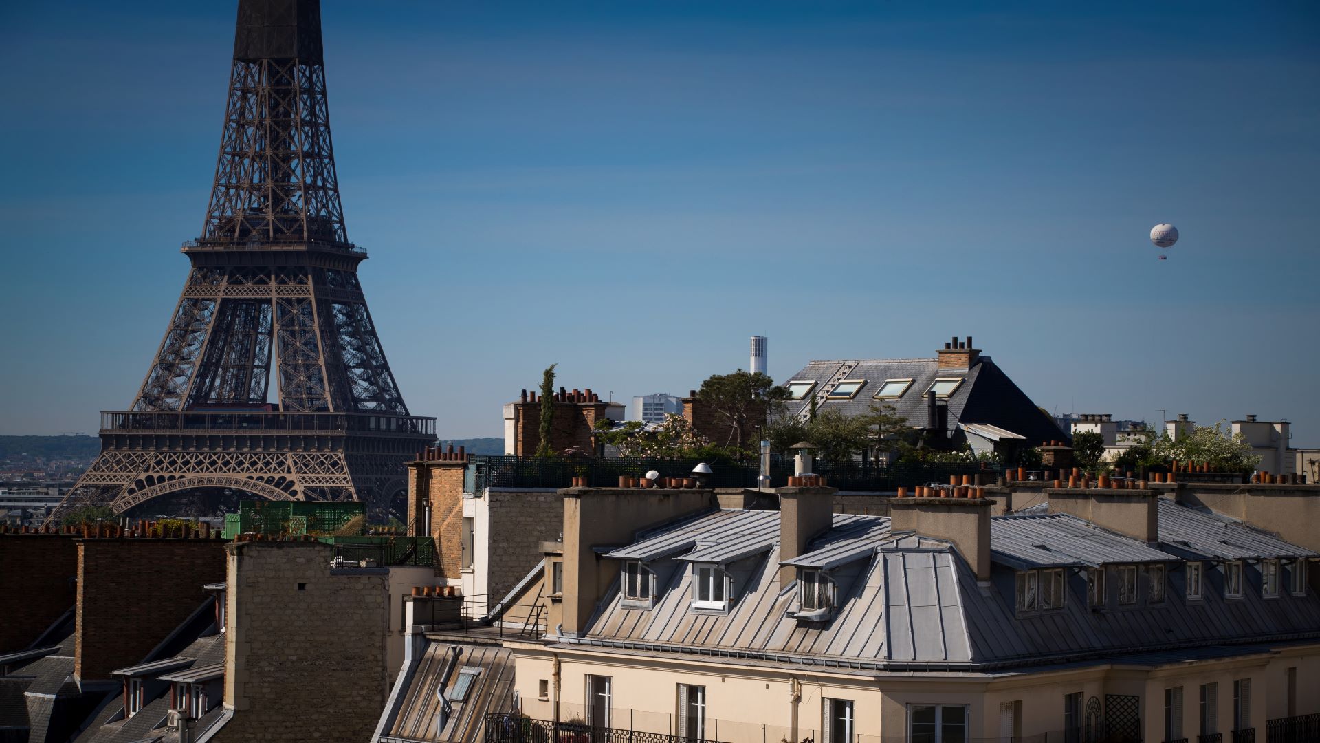 Image for the title: France eases Covid curbs, including outdoor mask-wearing 