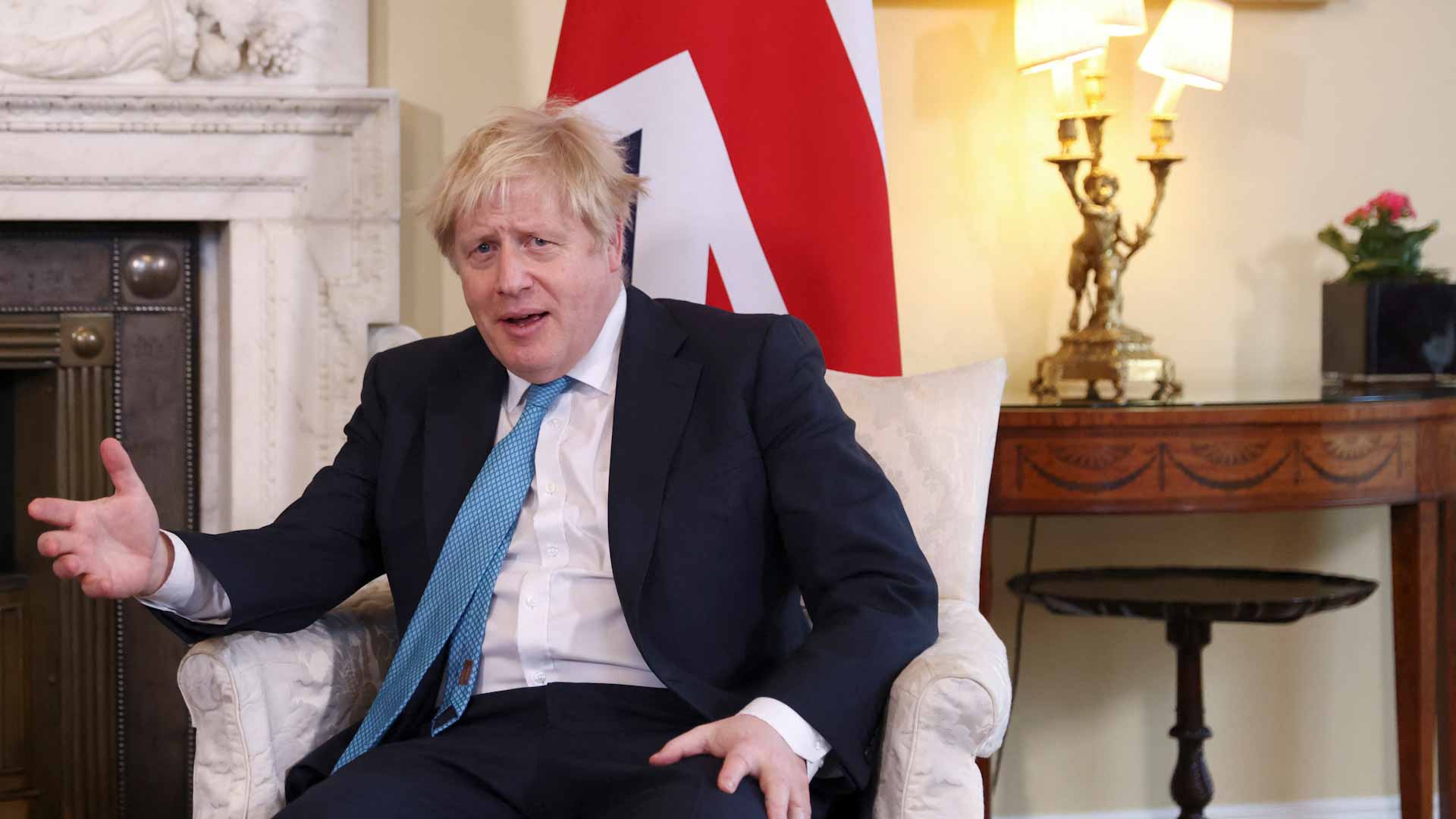 Image for the title: UK readies 1,000 more troops as Johnson visits NATO, Poland 