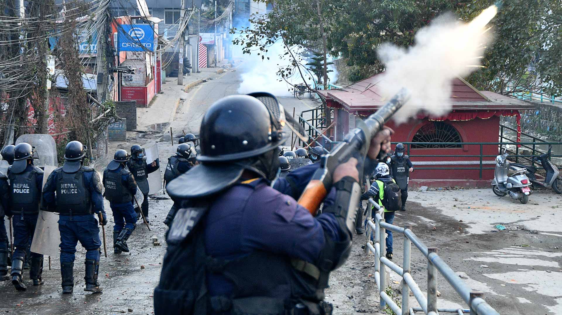 Image for the title: Nepal police fire tear gas, water cannon to disperse protest 