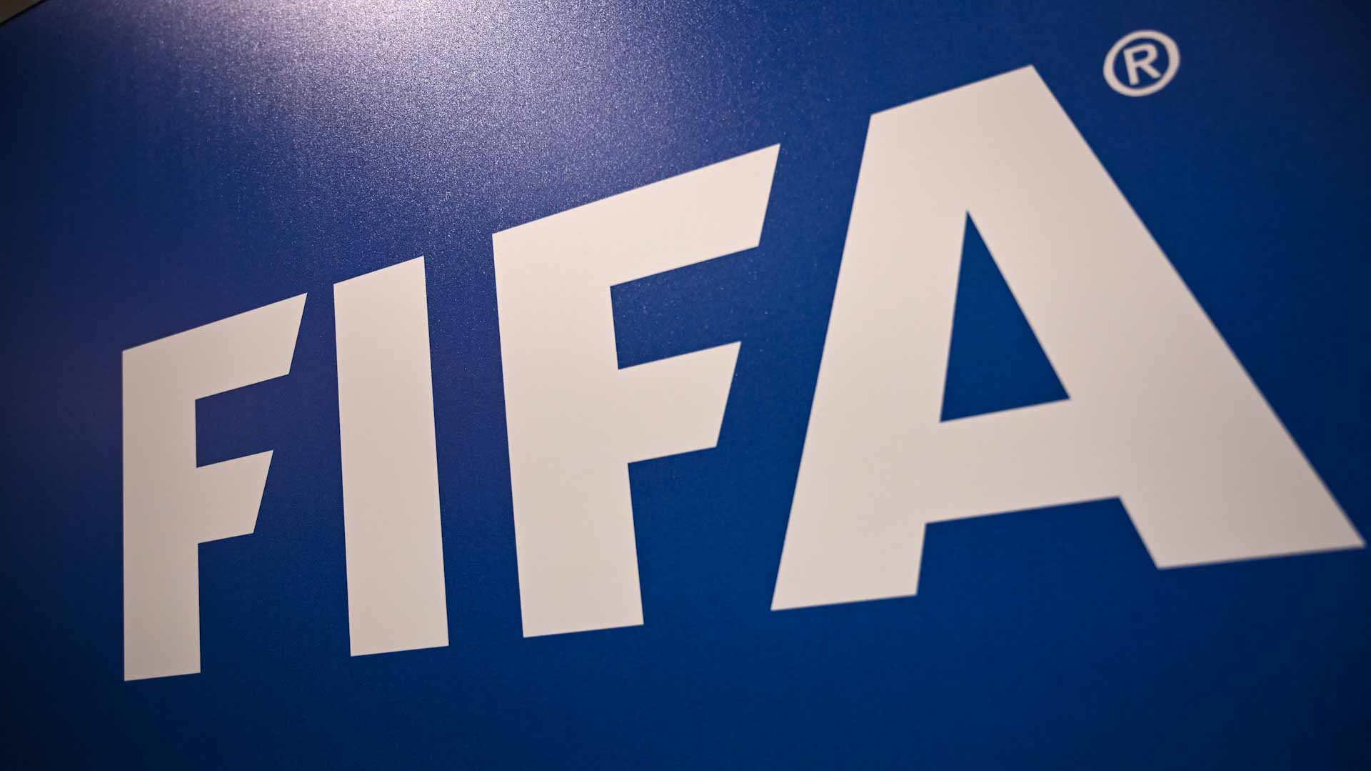 Image for the title: FIFA moves Russia home games and bans flag and anthem 