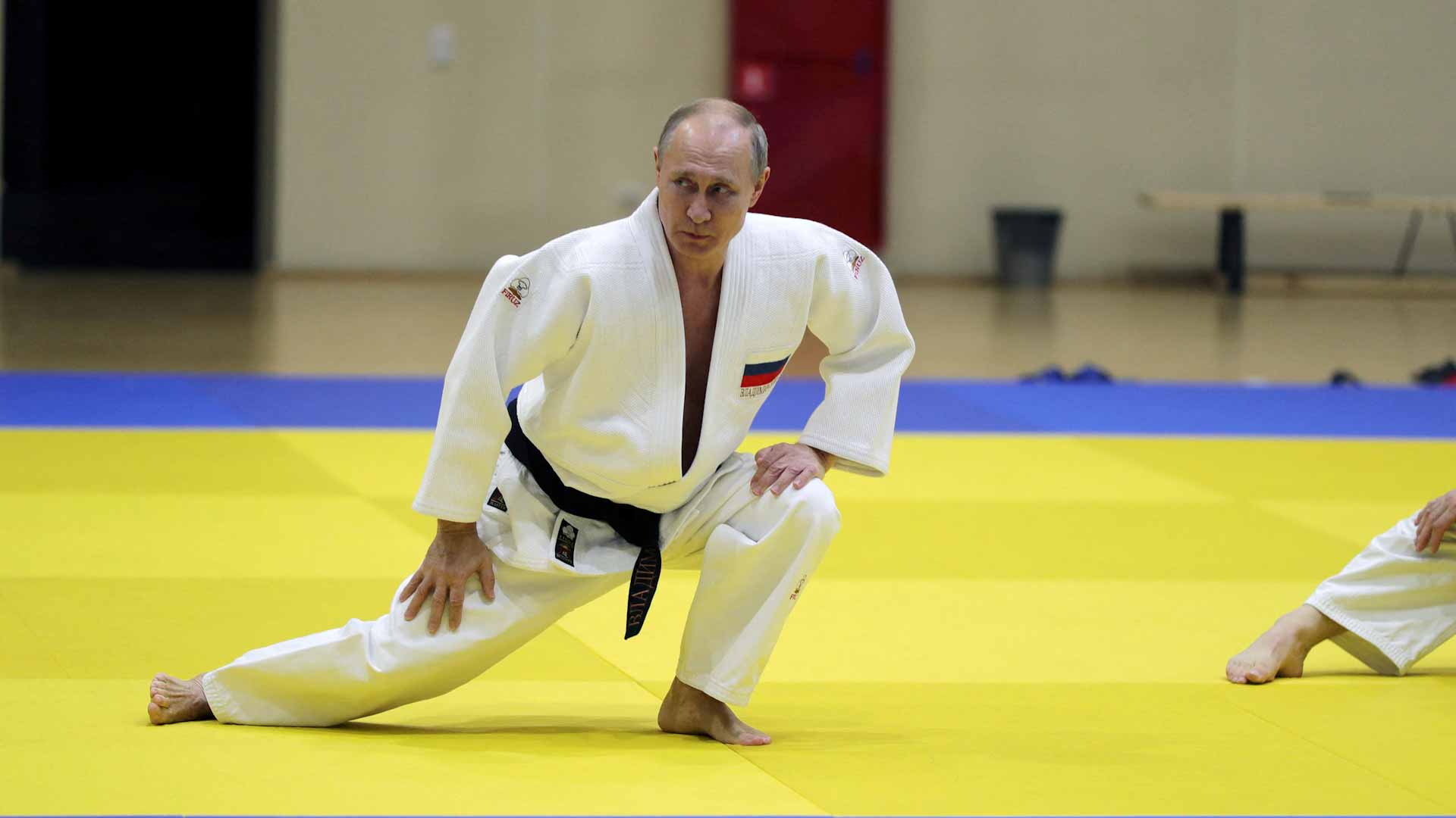 Image for the title: Putin stripped of black belt over Ukraine invasion 