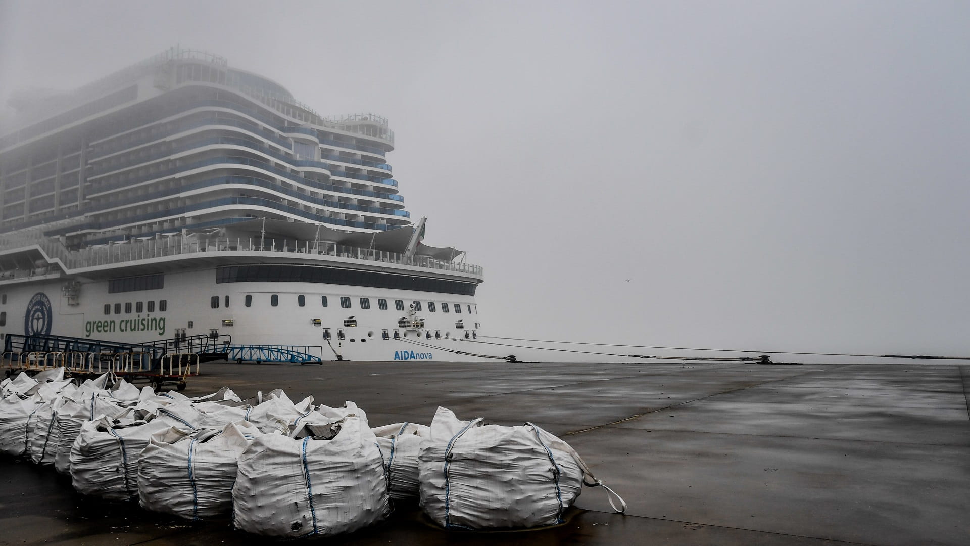 Image for the title: COVID outbreak ends cruise for thousands on German ship in Lisbon 