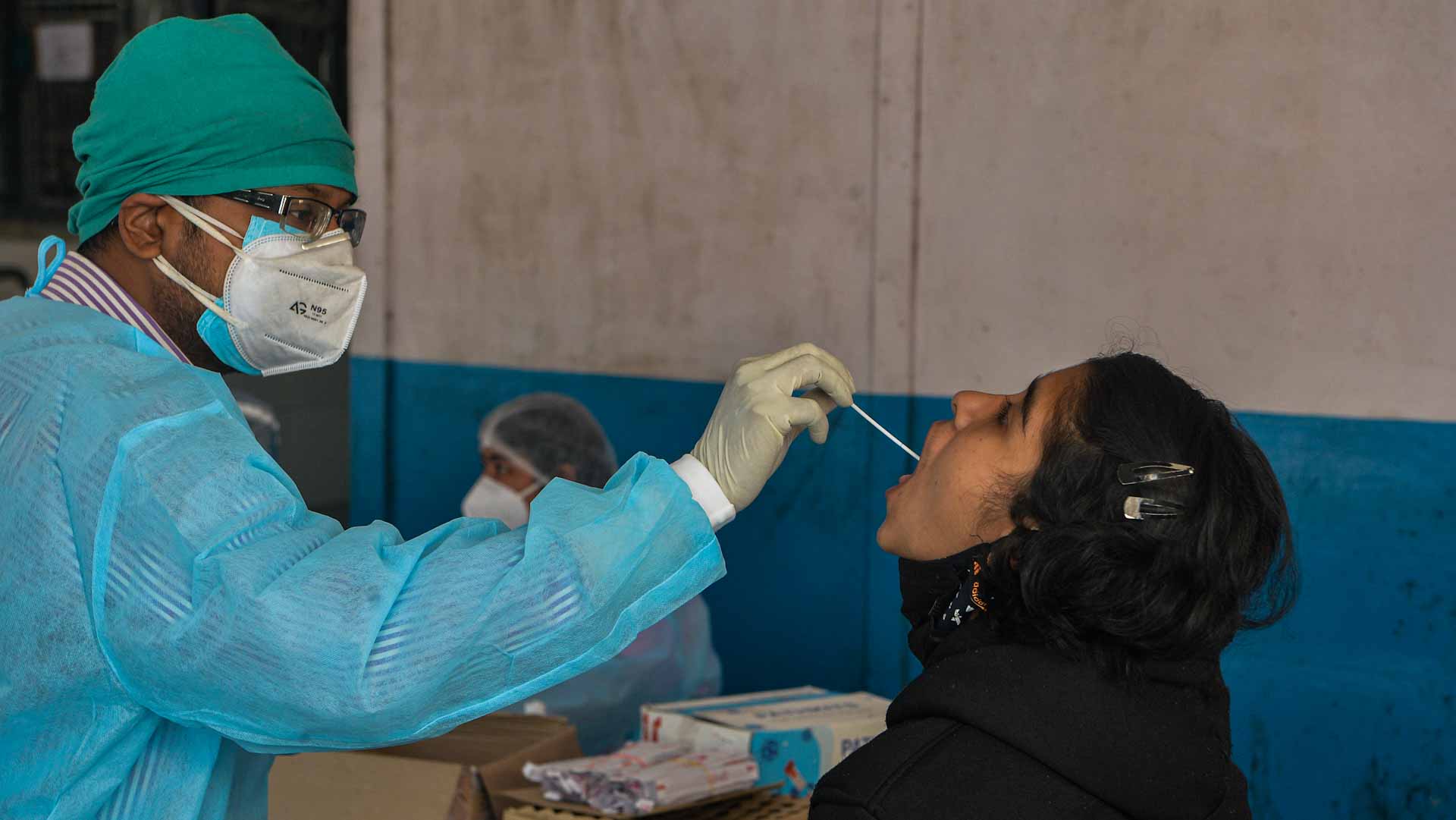 Image for the title: India's new COVID-19 cases jump 57% in a day to 90,928 