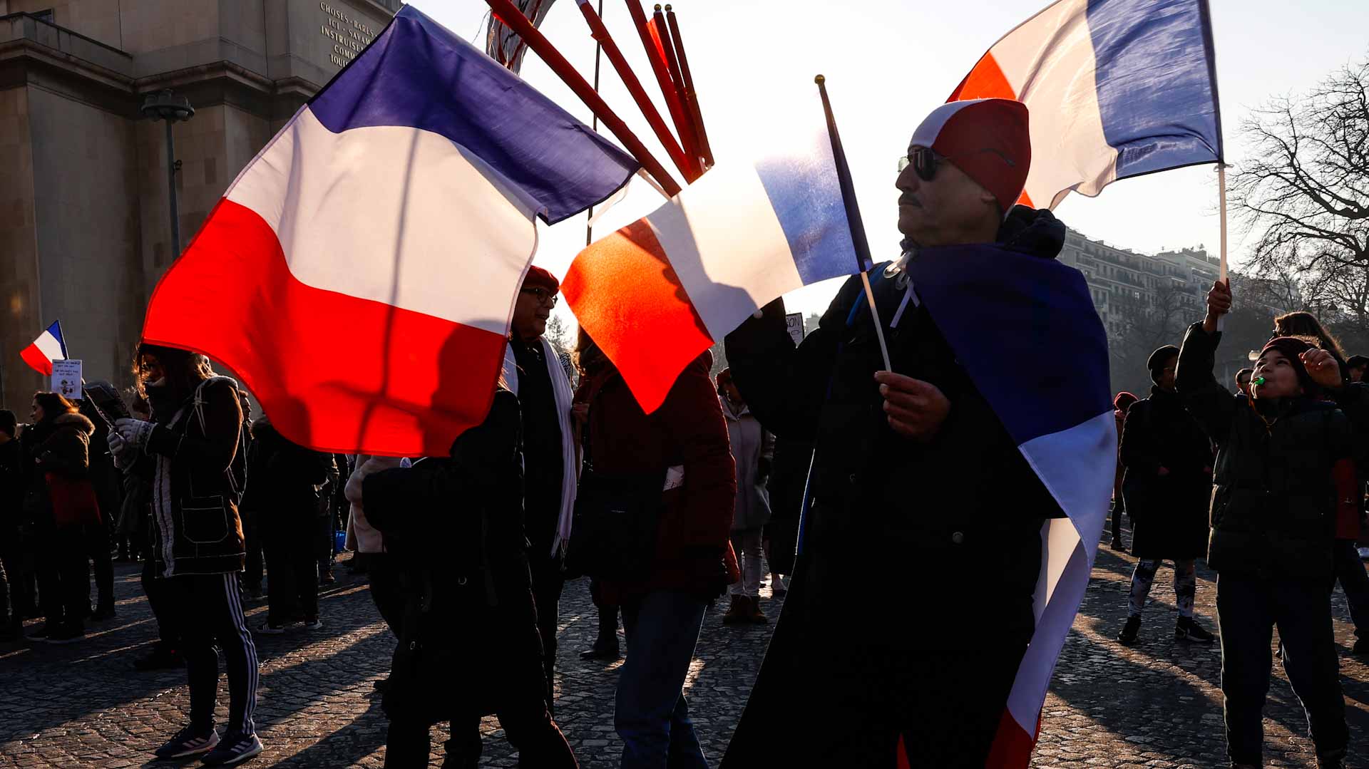 Image for the title: Protesters hit French streets to fight new vaccine pass 