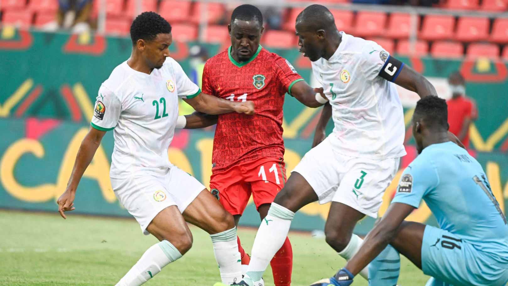 Image for the title: Senegal squeeze through to knockout phase after draw with Malawi 