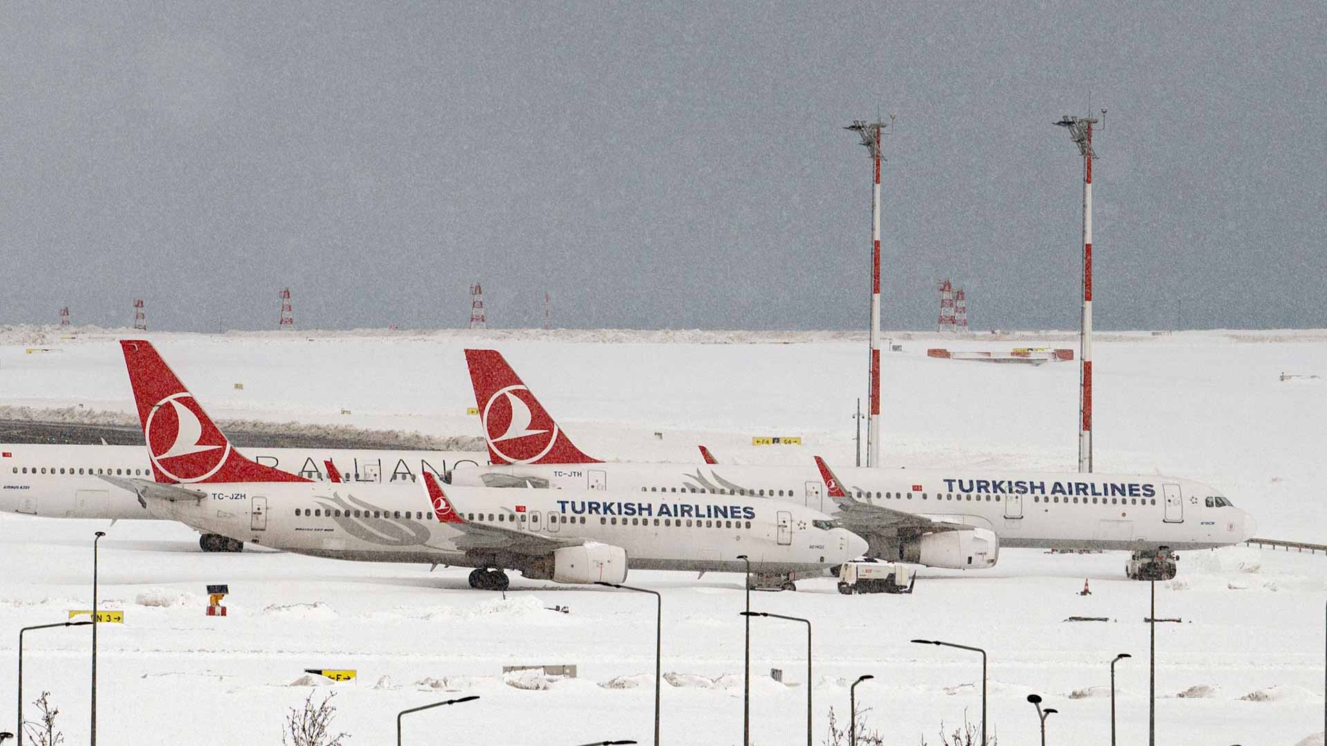 Image for the title: Istanbul's snowed-in airport stirs back to life 