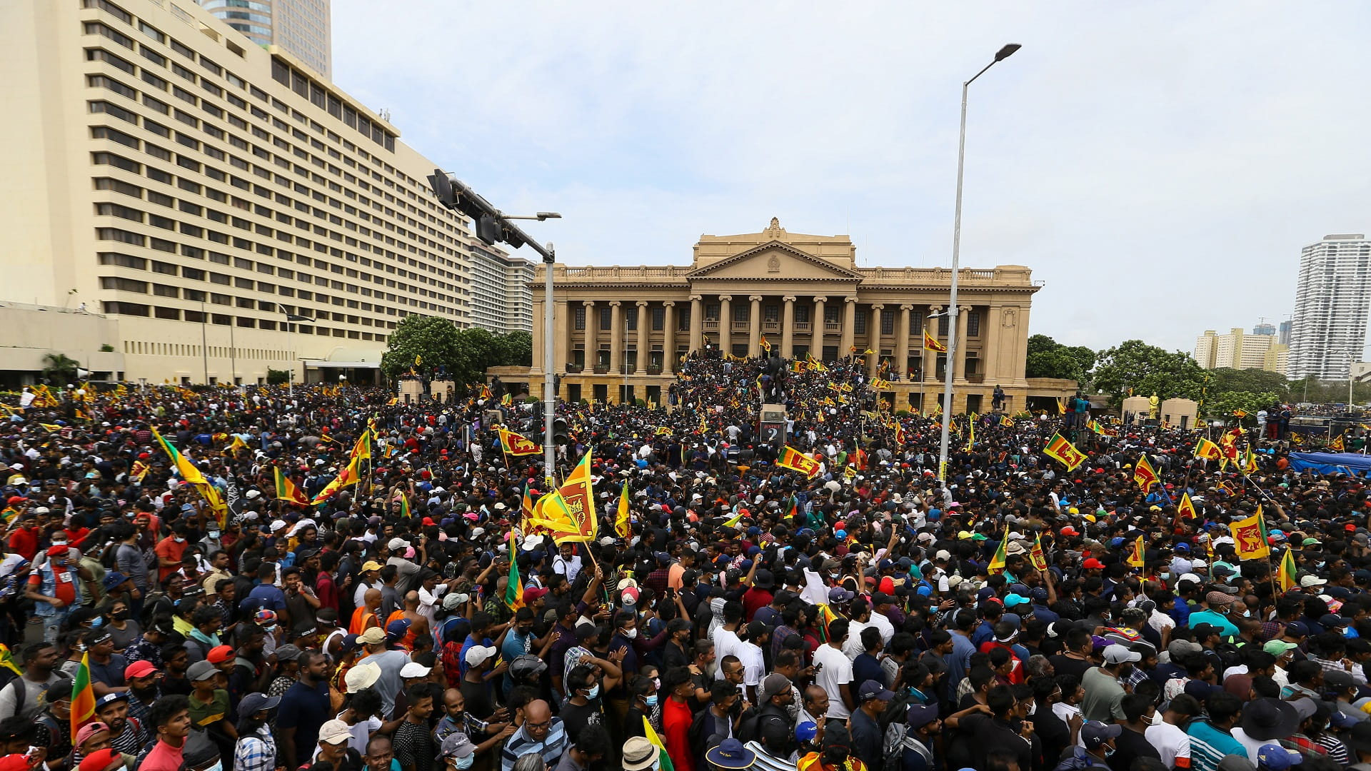 Image for the title: Sri Lanka's president to quit after chased from home 