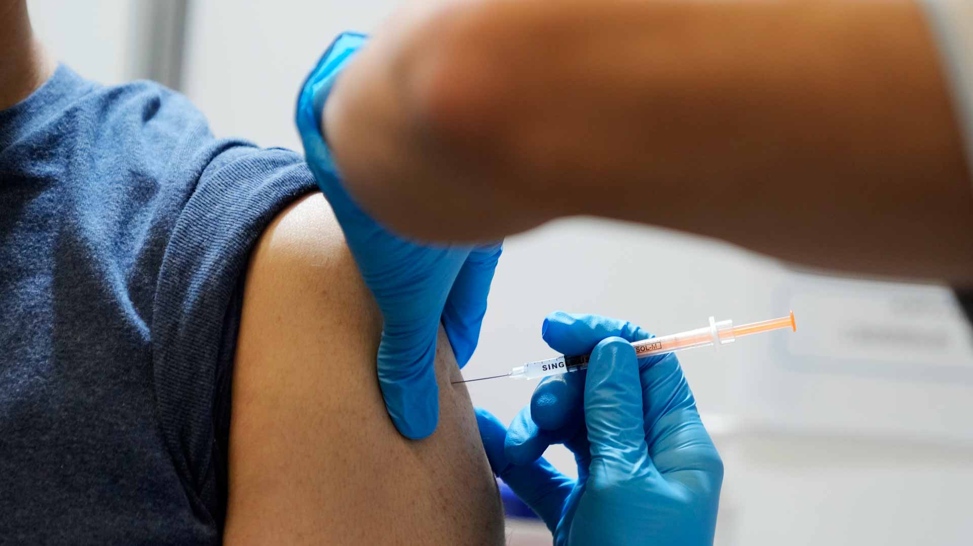 Image for the title: Japan's Shionogi starts COVID-19 vaccine trial among children 