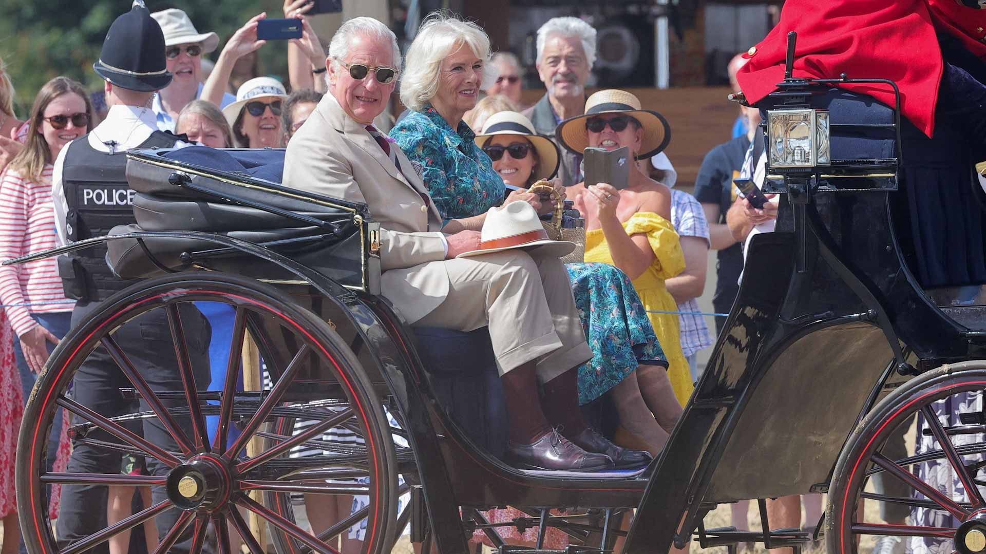 Image for the title: Britain's Prince Charles and Camilla visit flower show 