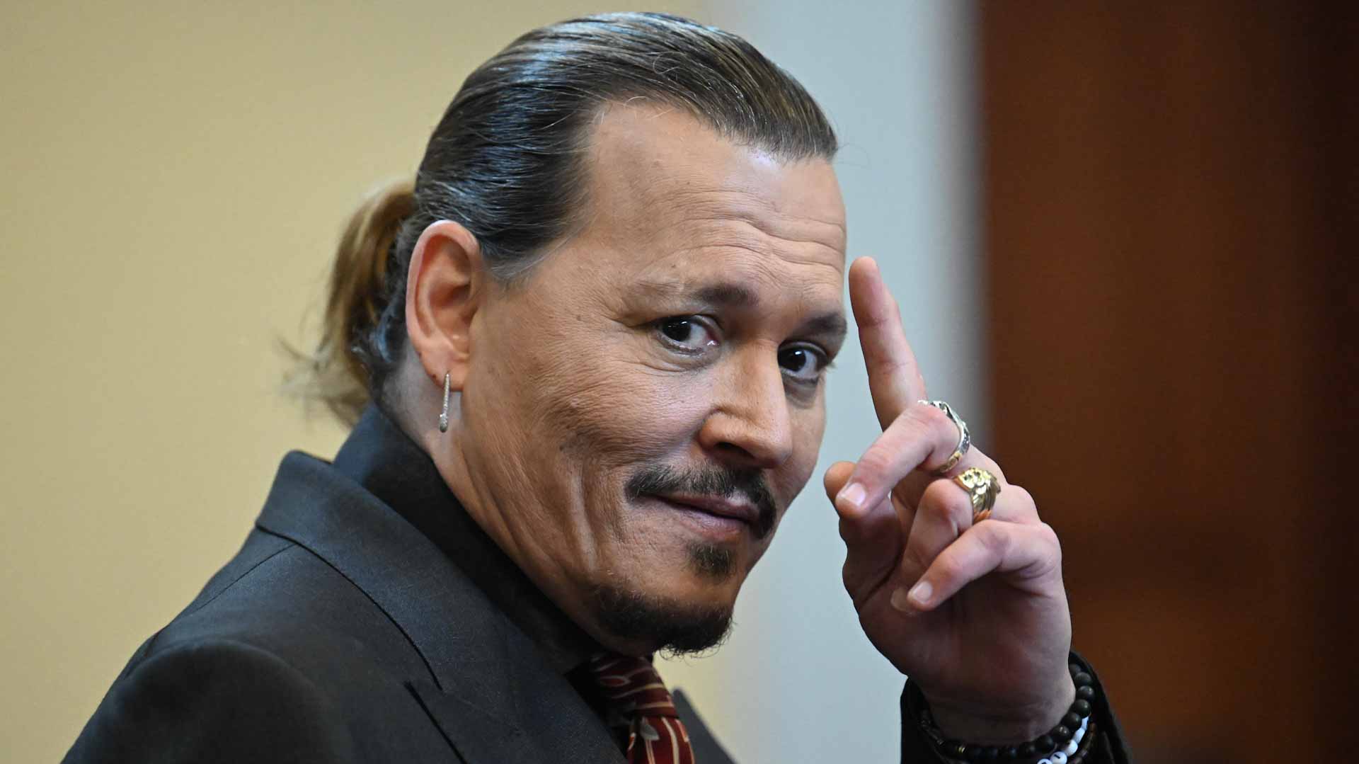 Image for the title: Depp wins out in bitter Heard defamation trial 