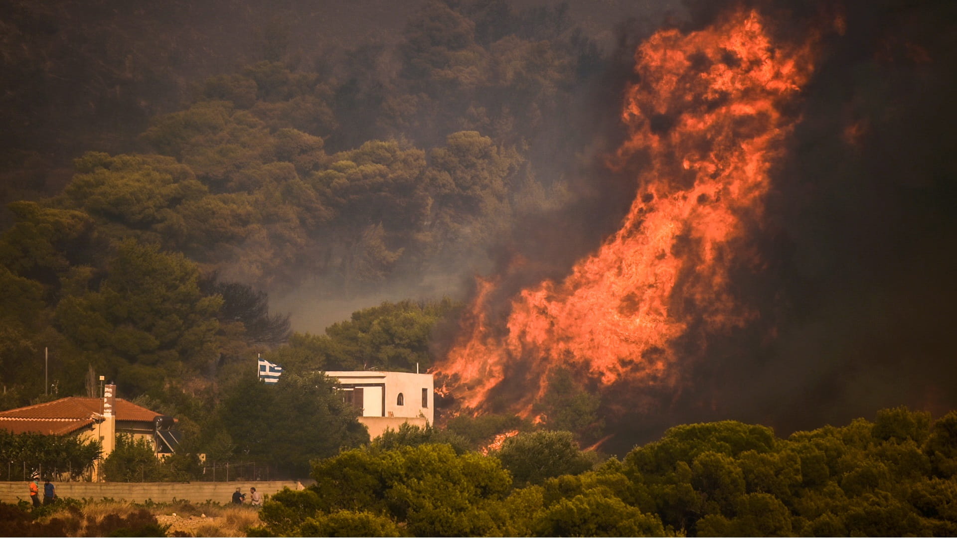 Image for the title: Wildfire threatens southern suburb of Athens 