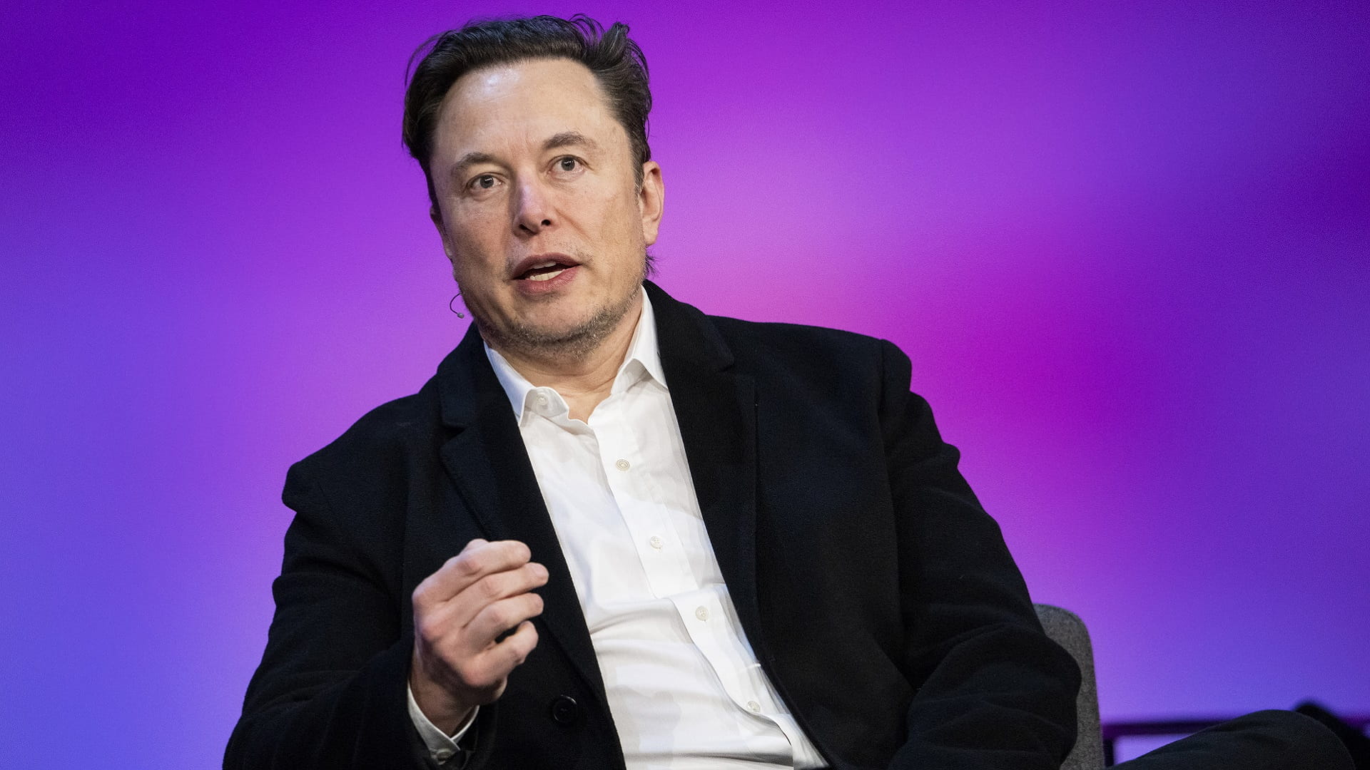 Image for the title: Musk's warning could be auto industry's 'canary 