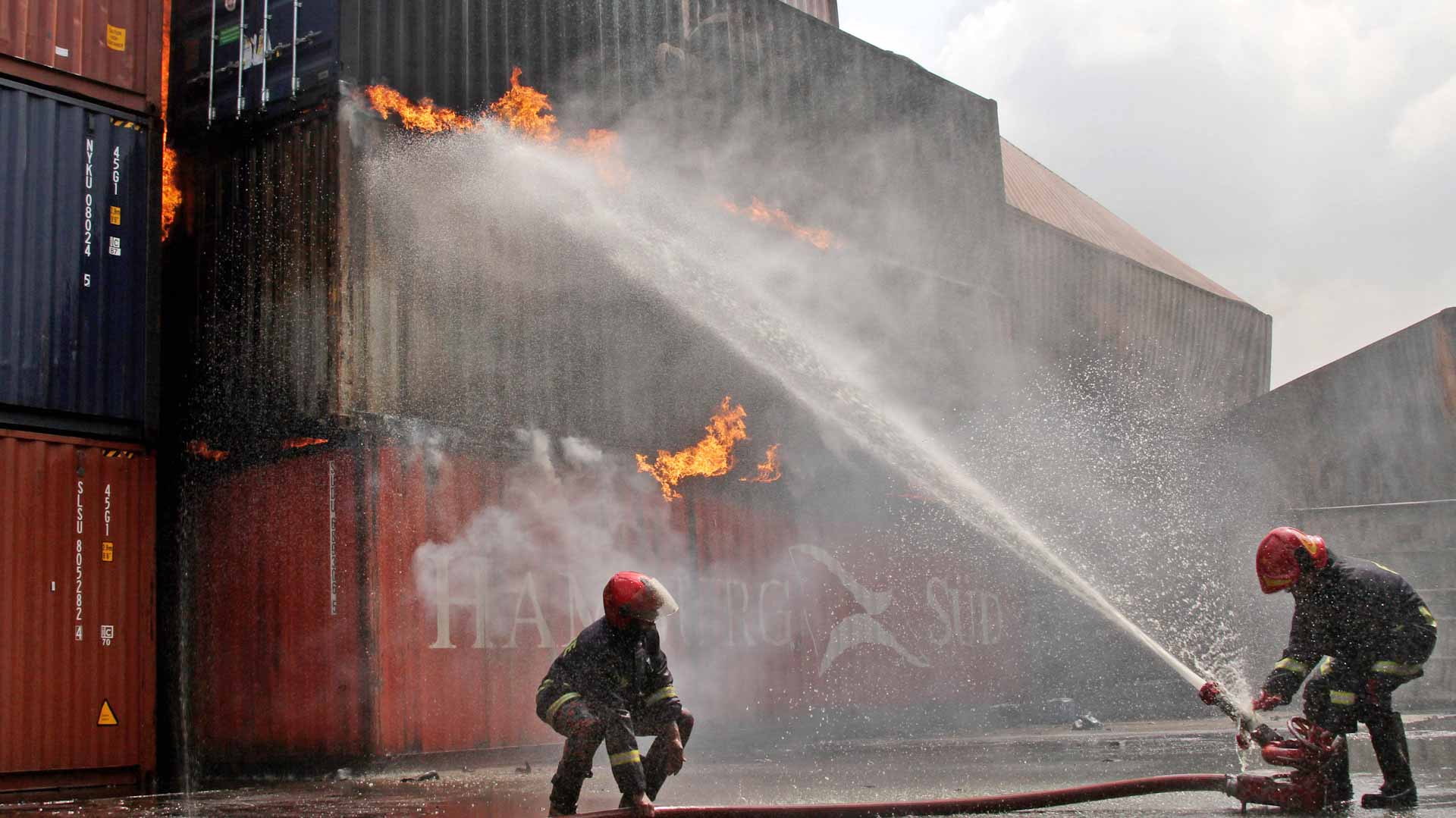 Image for the title: Deadly Bangladesh container depot fire brought under control 