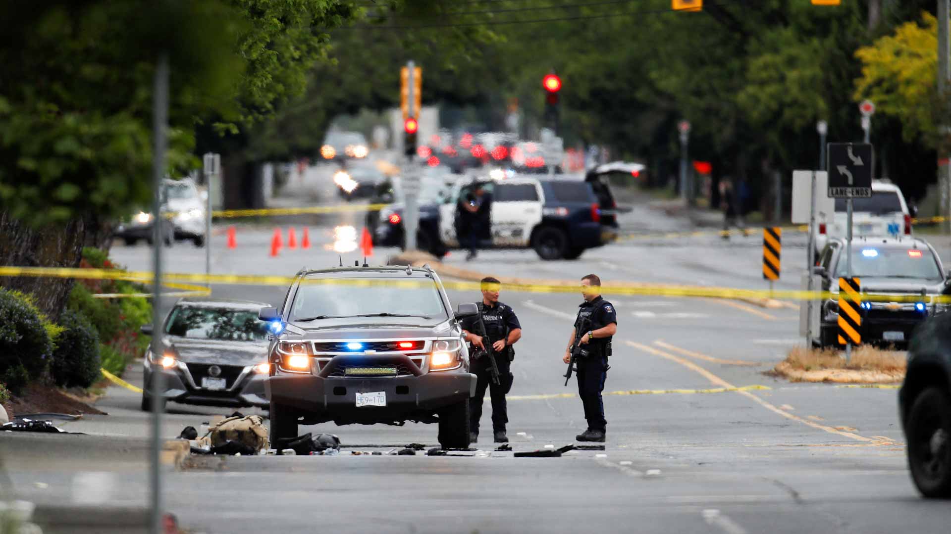 Image for the title: Two suspects killed, six officers injured in Canada bank robbery 