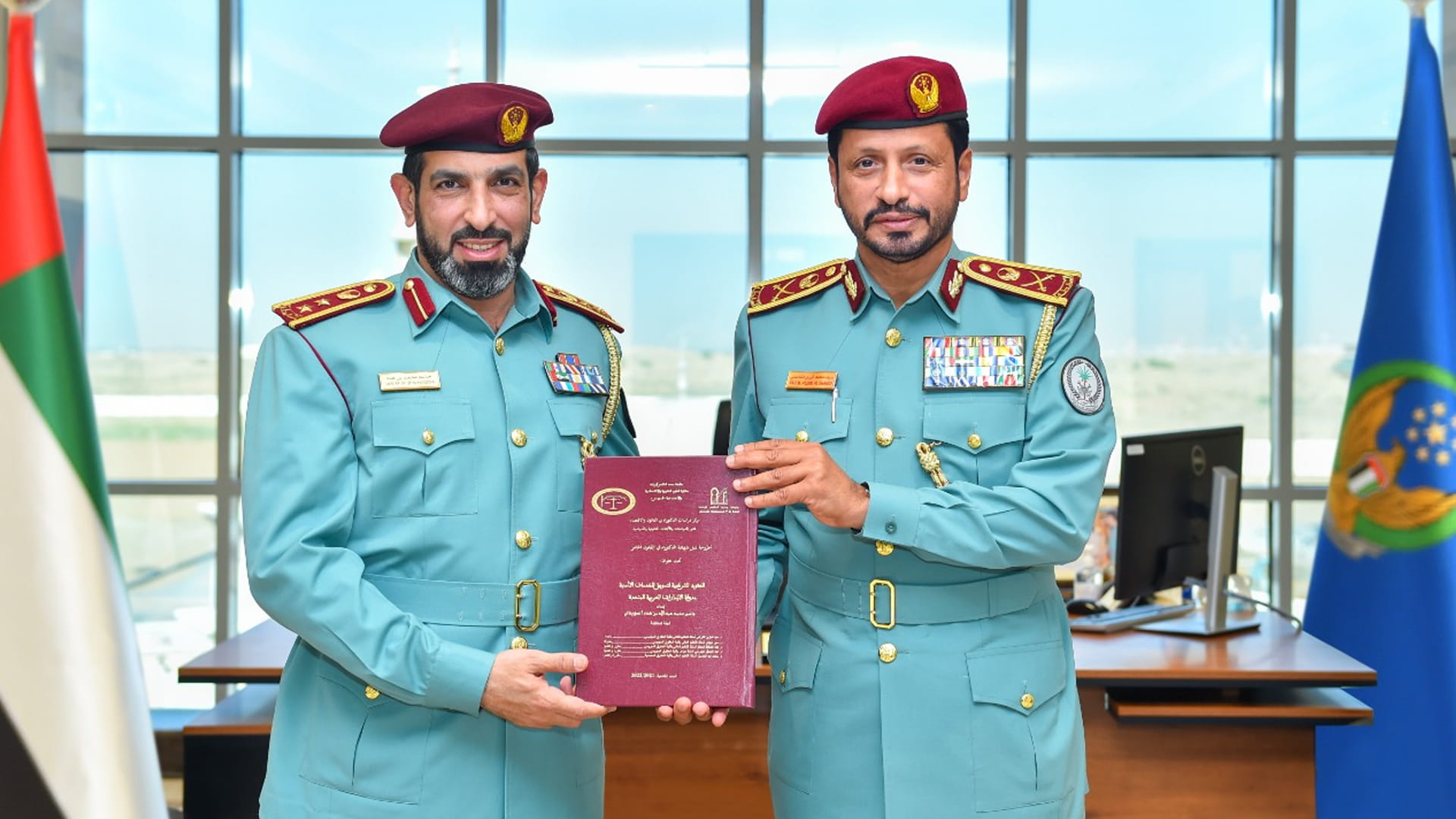 Image for the title: Chief of Police congratulates Operations’ Director on Ph.D. 