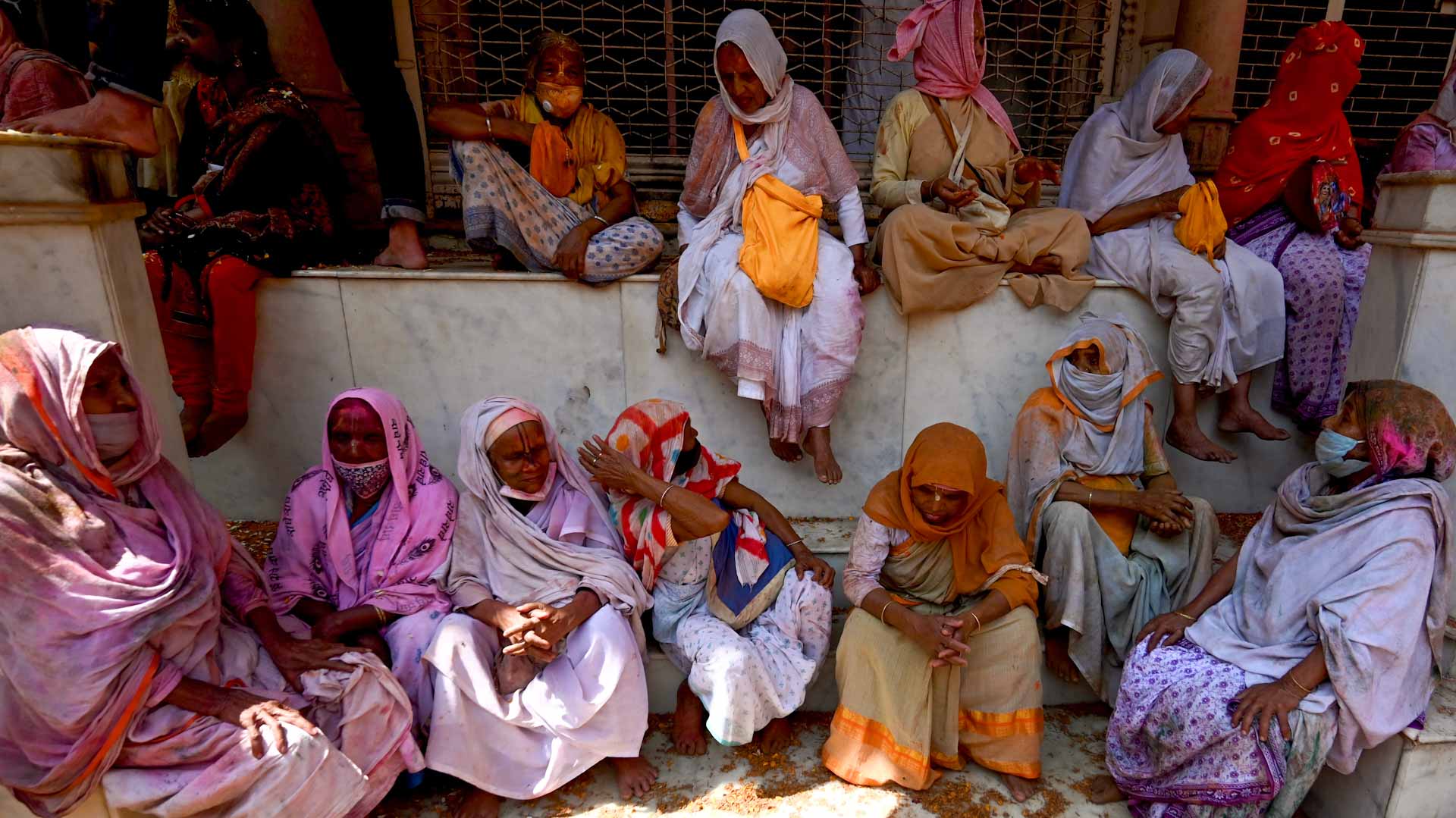 Image for the title: Widows brighten the day as India celebrates Holi 