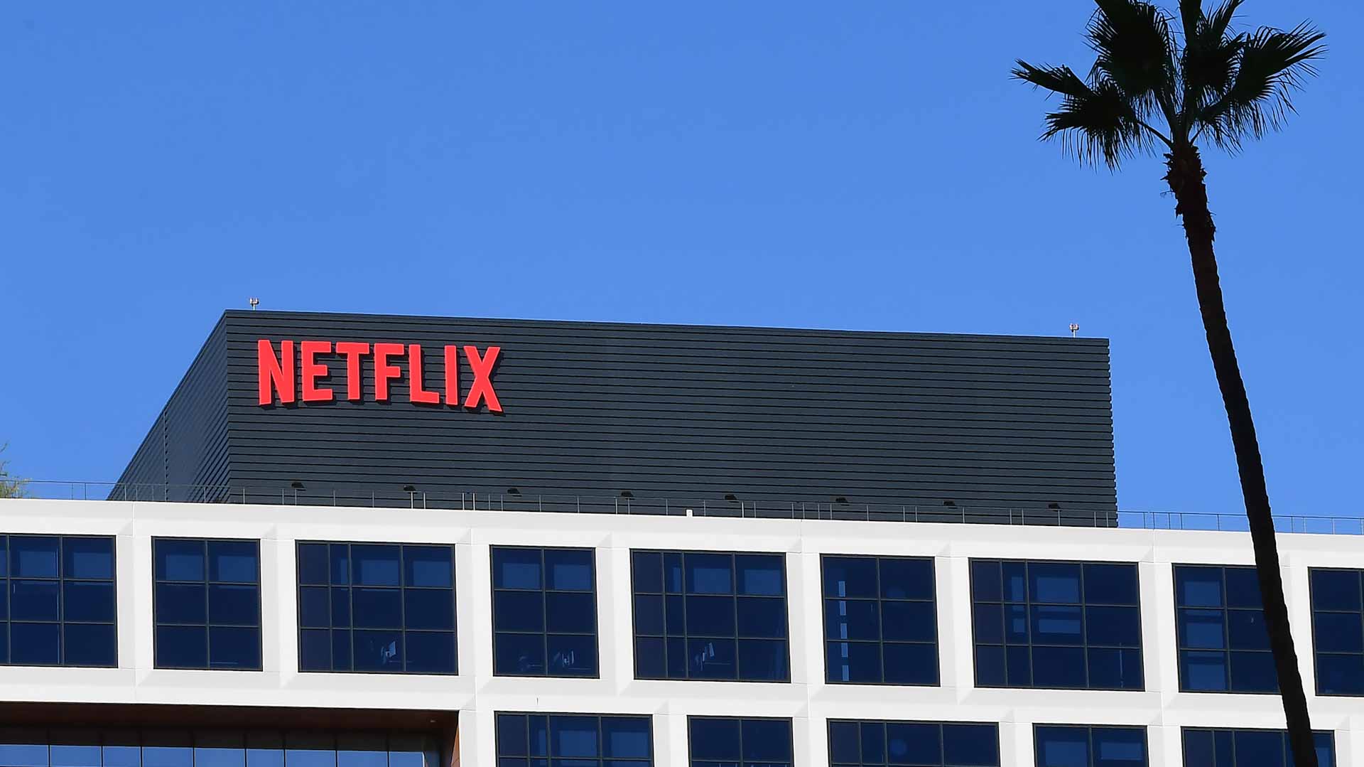 Image for the title: Netflix tests charging a fee to share accounts 