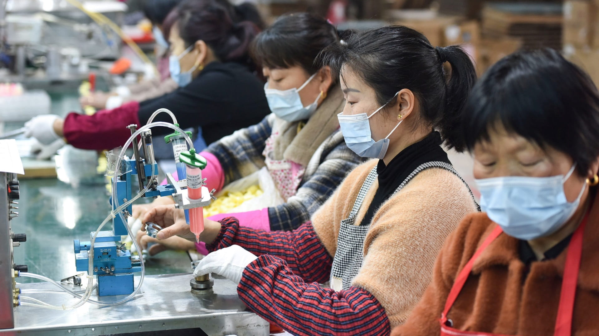 Image for the title: China's factory activity shrinks as Covid hits economy 