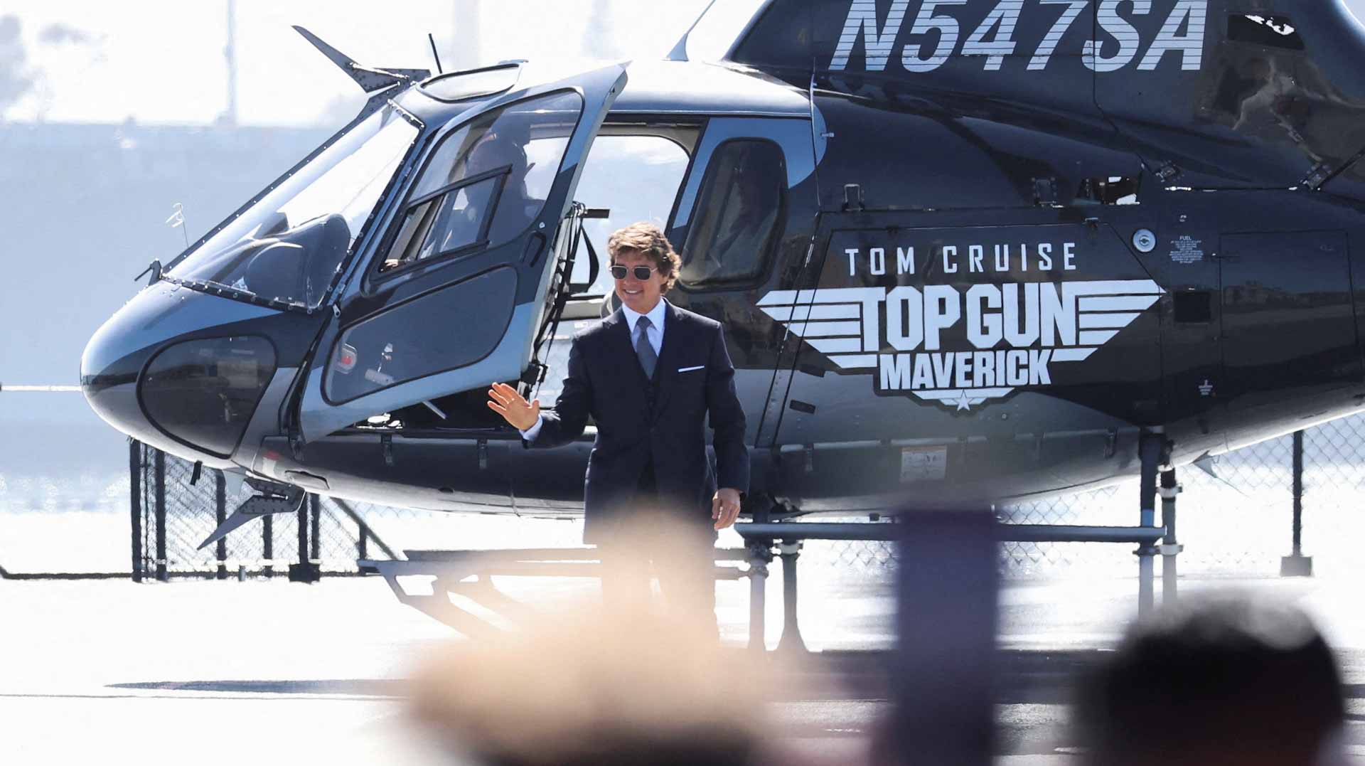 Image for the title: Tom Cruise flies onto aircraft carrier to launch 'Top Gun' movie 