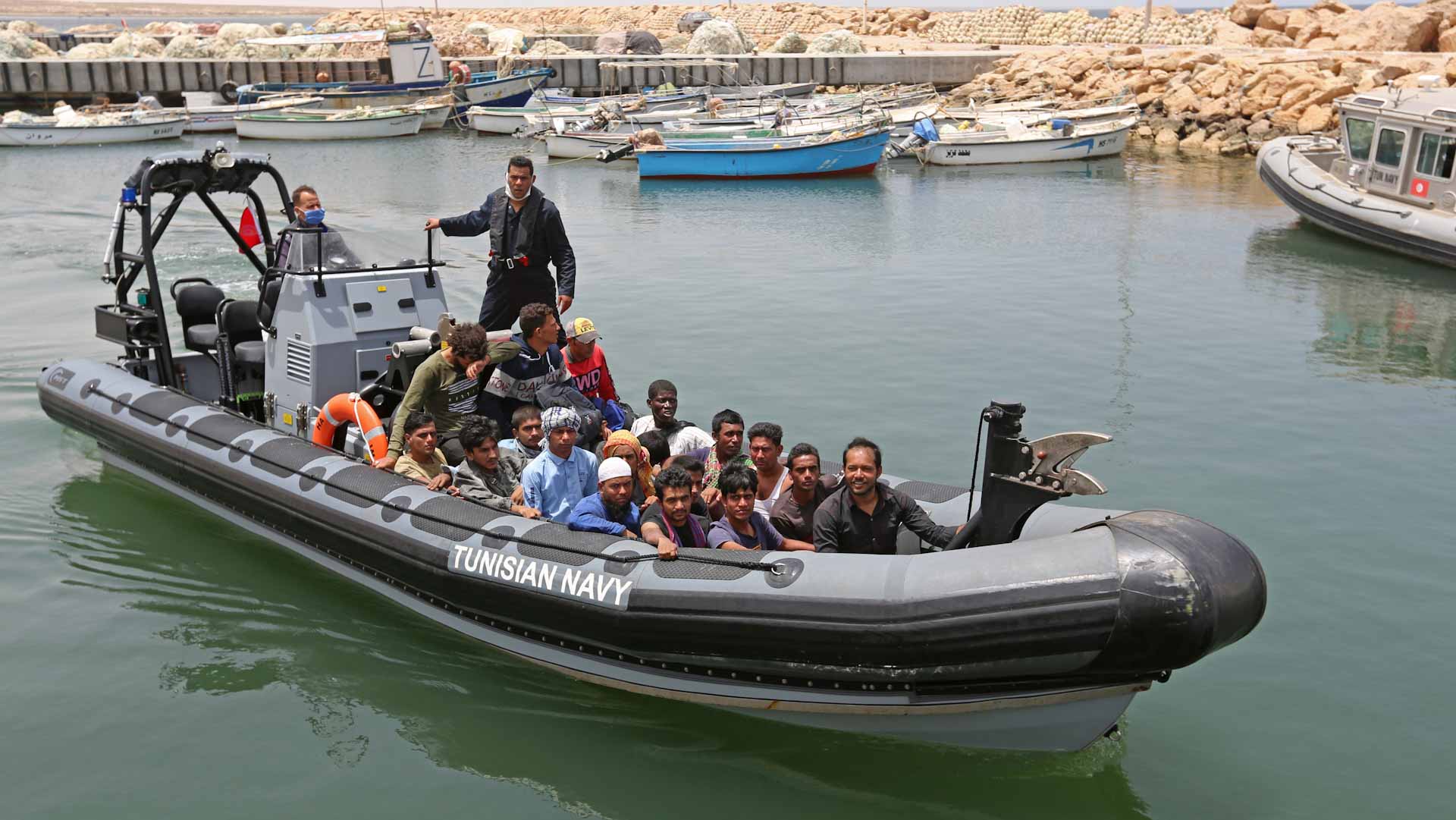 Image for the title: Death toll rises to 24 after boats capsize off Tunisia: official 