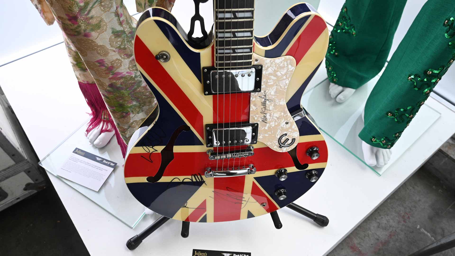 Image for the title: Guitar that broke up Oasis sells for $390,000 