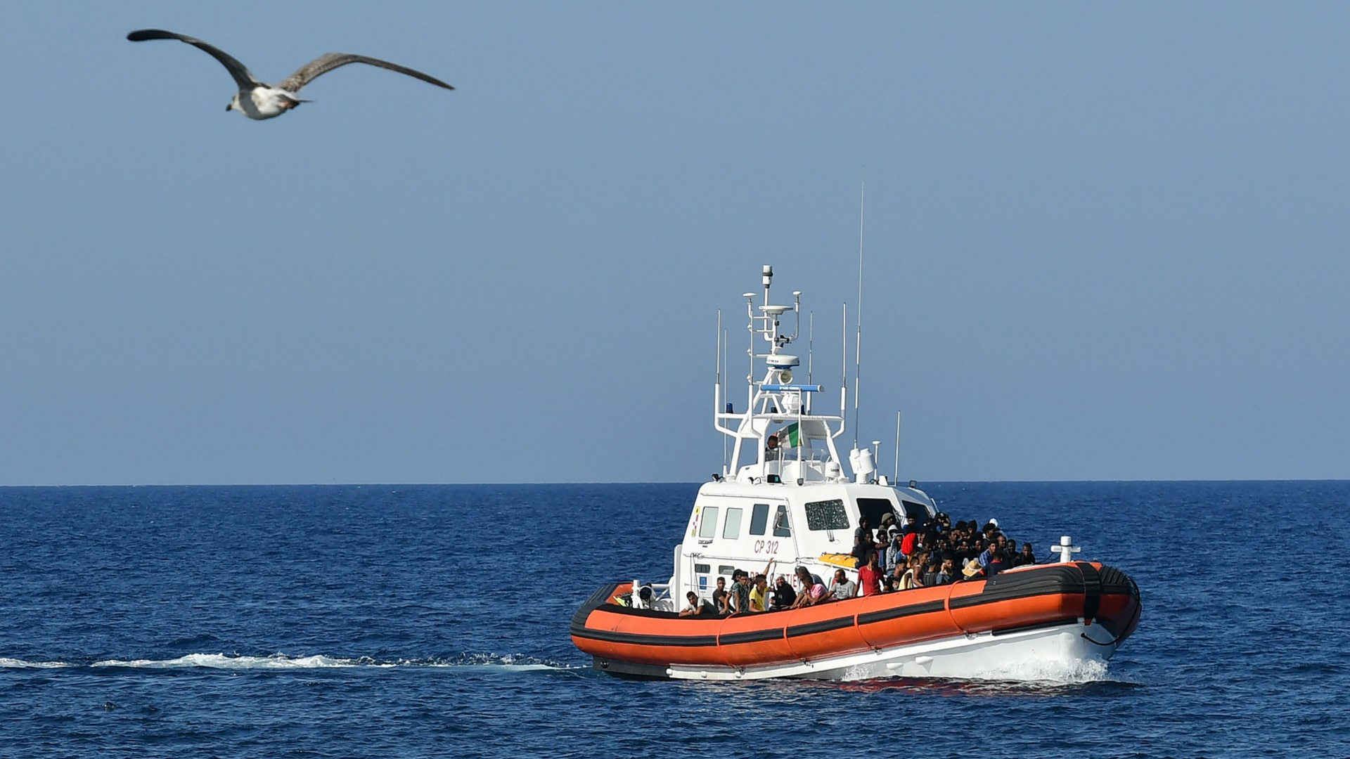 Image for the title: Three migrants dead, 10 missing as boat capsizes off Tunisia 