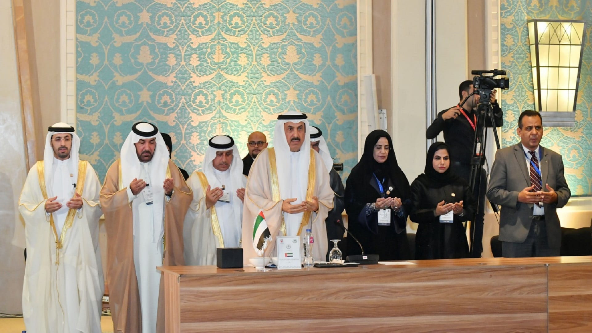 Image for the title: Members of AIPU observe minute of silence in mourning for Khalifa 