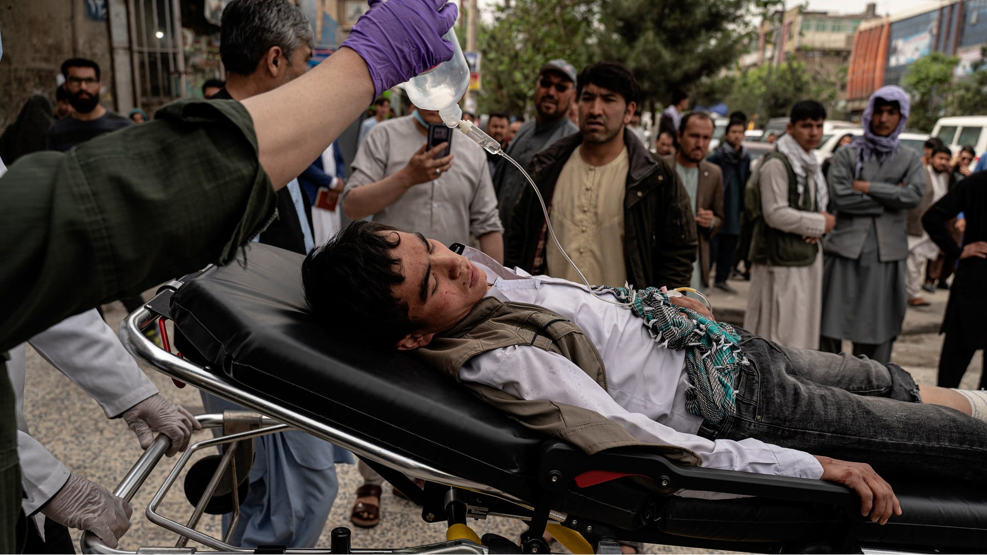 Image for the title: At least 9 killed as 3 bombs strike minibuses in Afghan city 