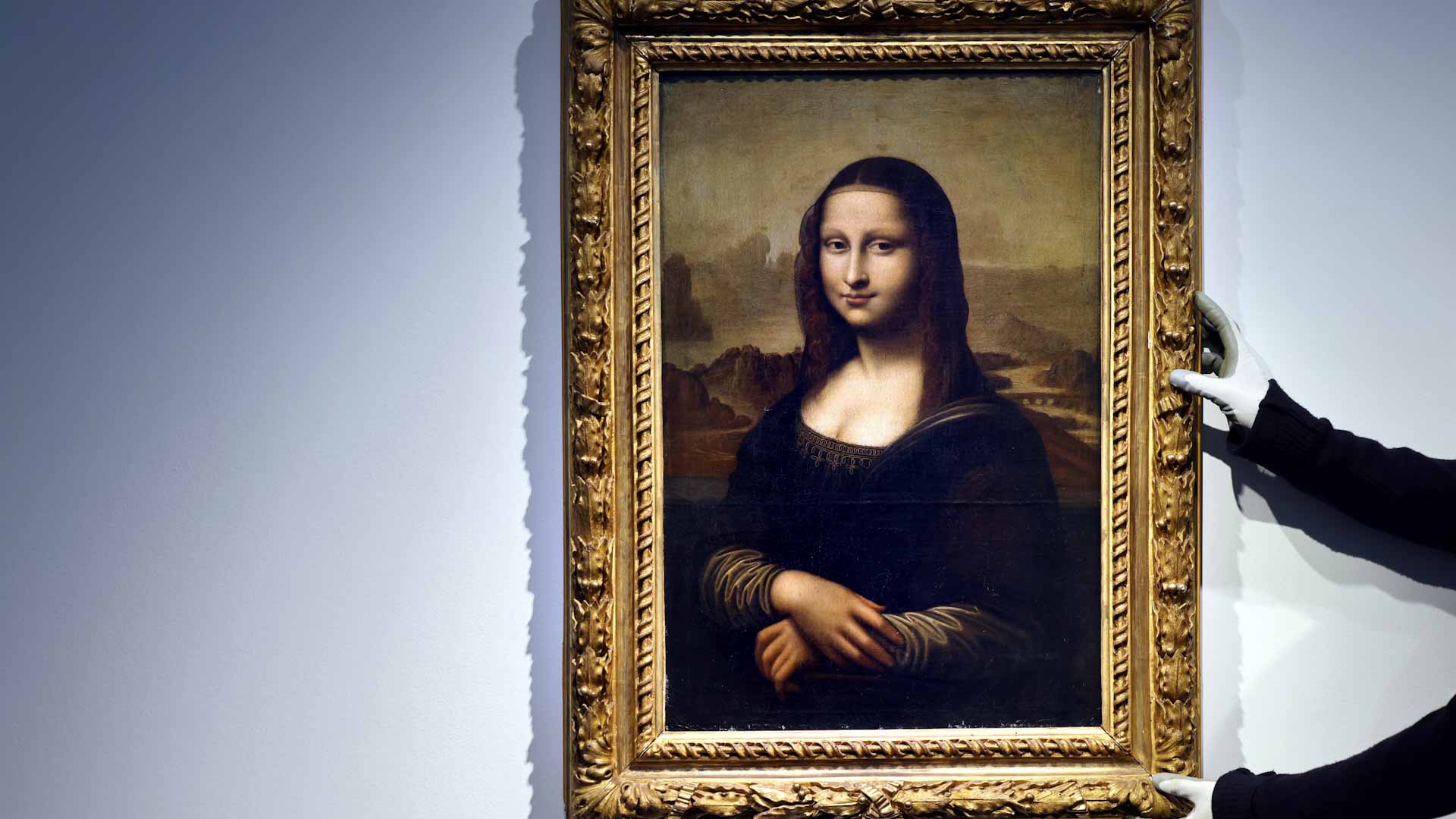 Image for the title: Man arrested after smearing Mona Lisa with cake at Louvre 