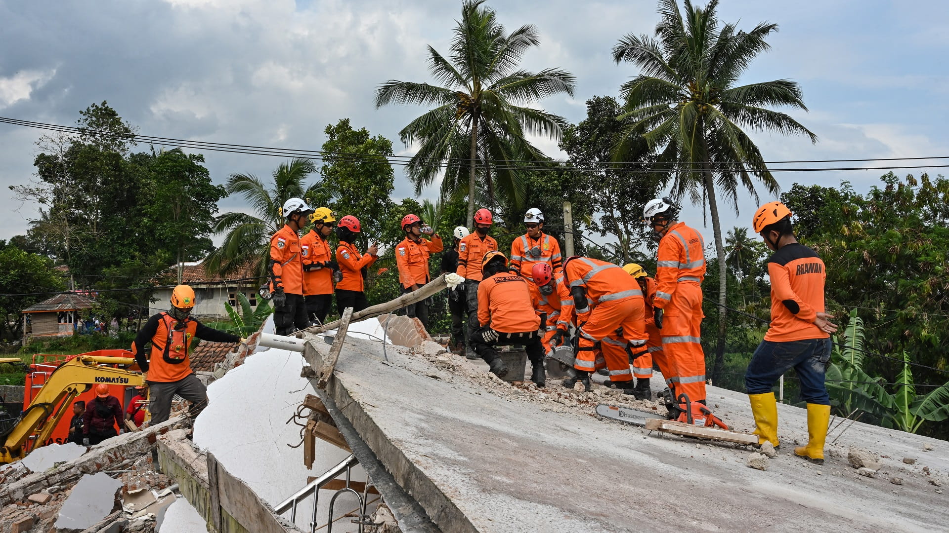 Image for the title: Indonesian rescuers race to find dozens missing after quake 