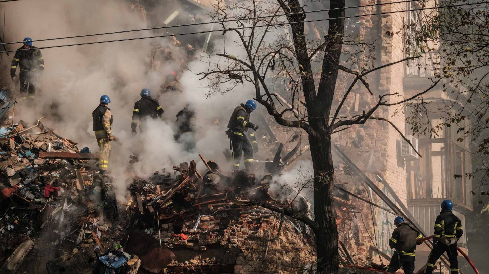 Image for the title: Drones spark gunfire, fearful cries before exploding in Kyiv 