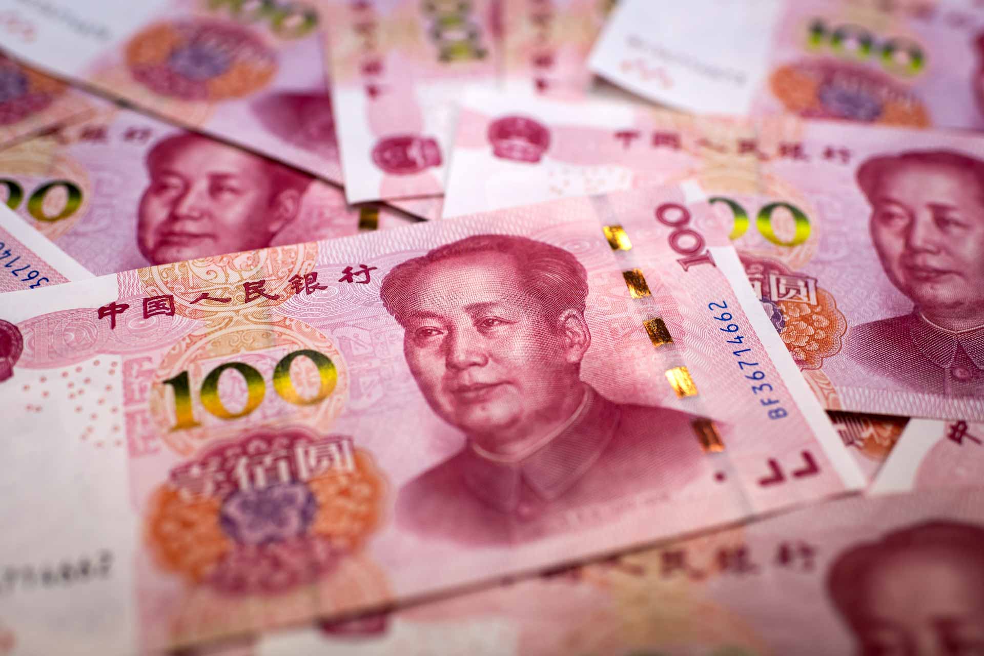 Image for the title: China's currency drops to its lowest level in 15 years. 