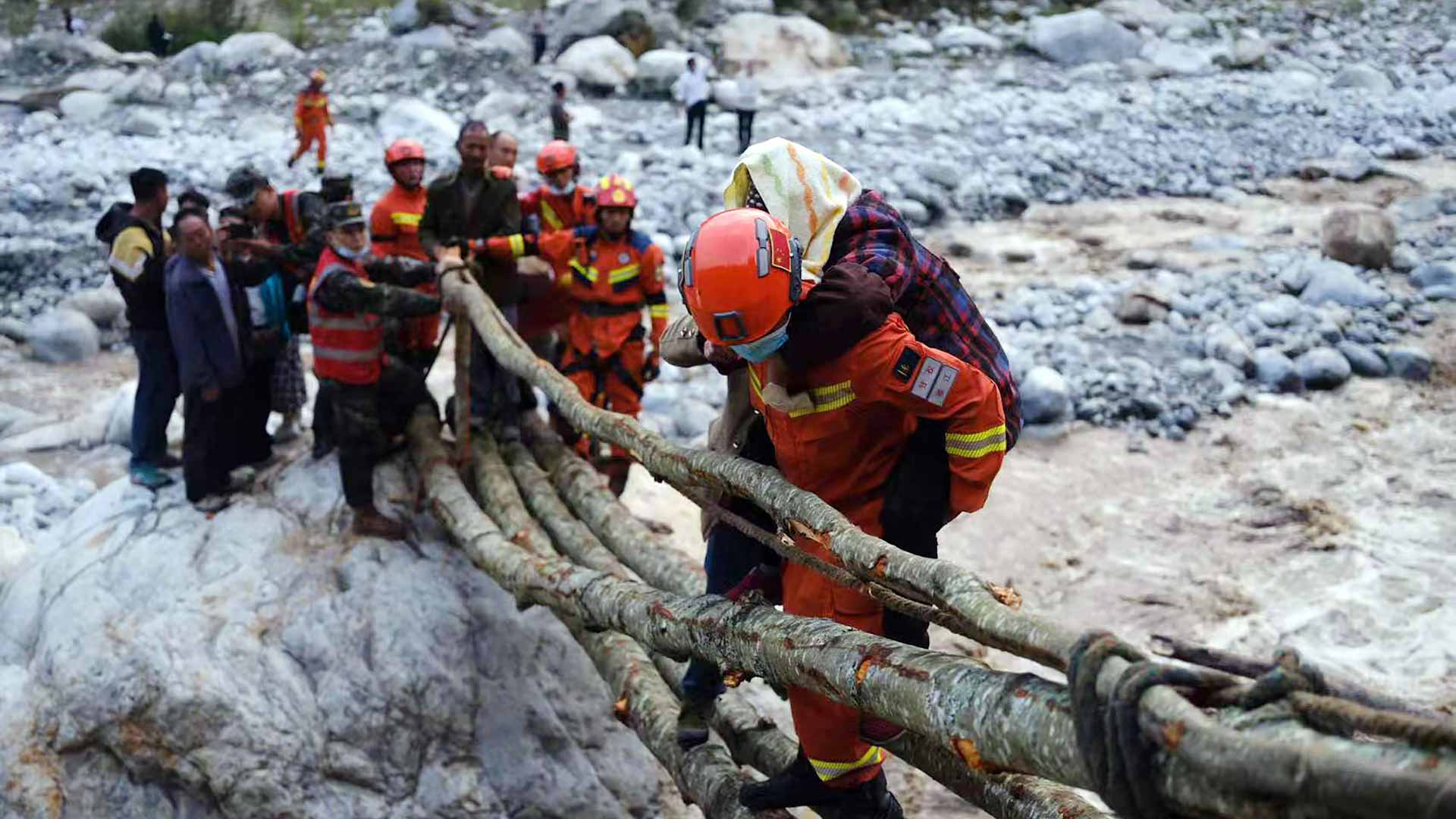 Image for the title: Rescuers scour for survivors after dozens killed in China quake 