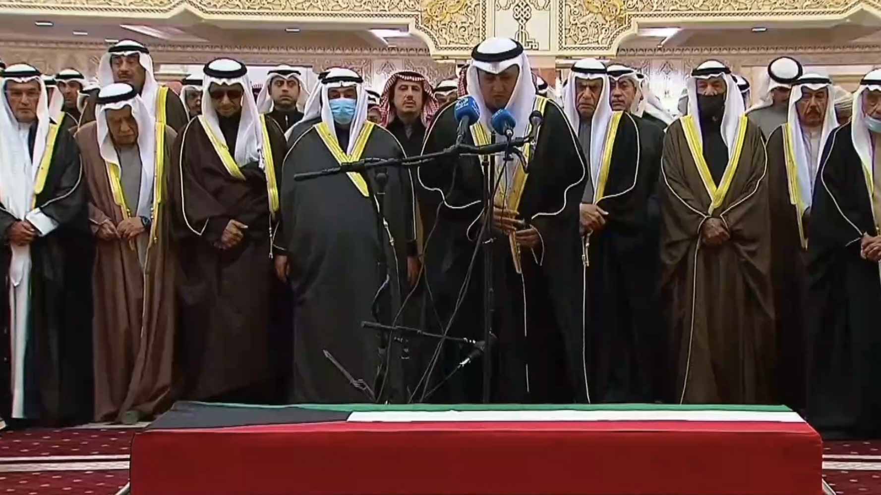 Image for the title: Kuwait Amir, senior Sheikhs, citizens perform prayer on late Amir 