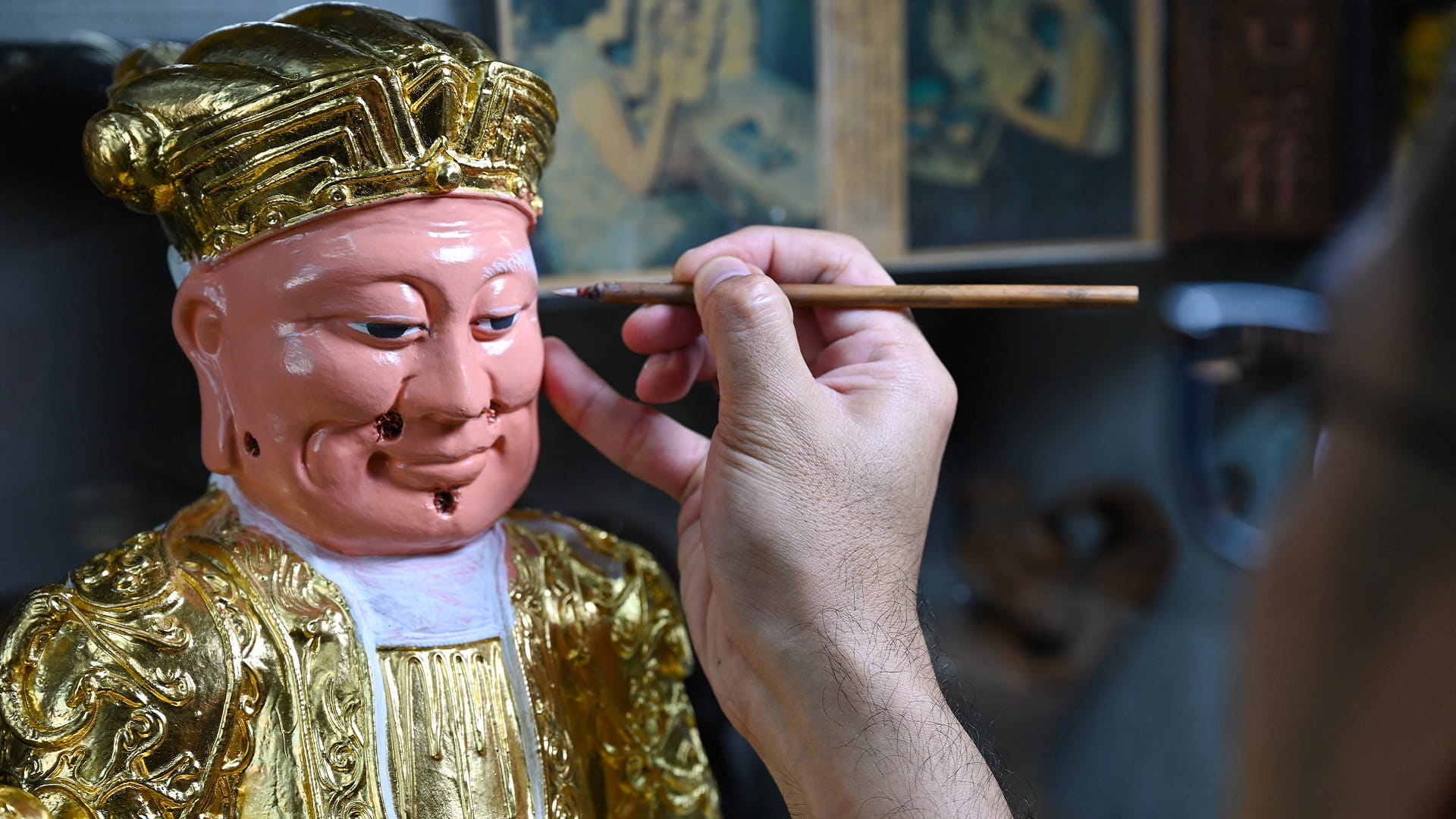 Image for the title: Singaporean artisan family keeps religious effigy art alive 