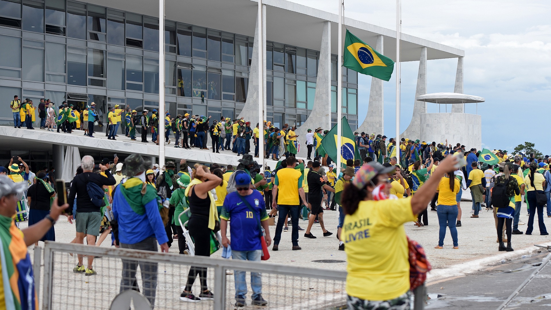 Image for the title: Bolsonaro supporters storm Brazil Congress, presidential palace 