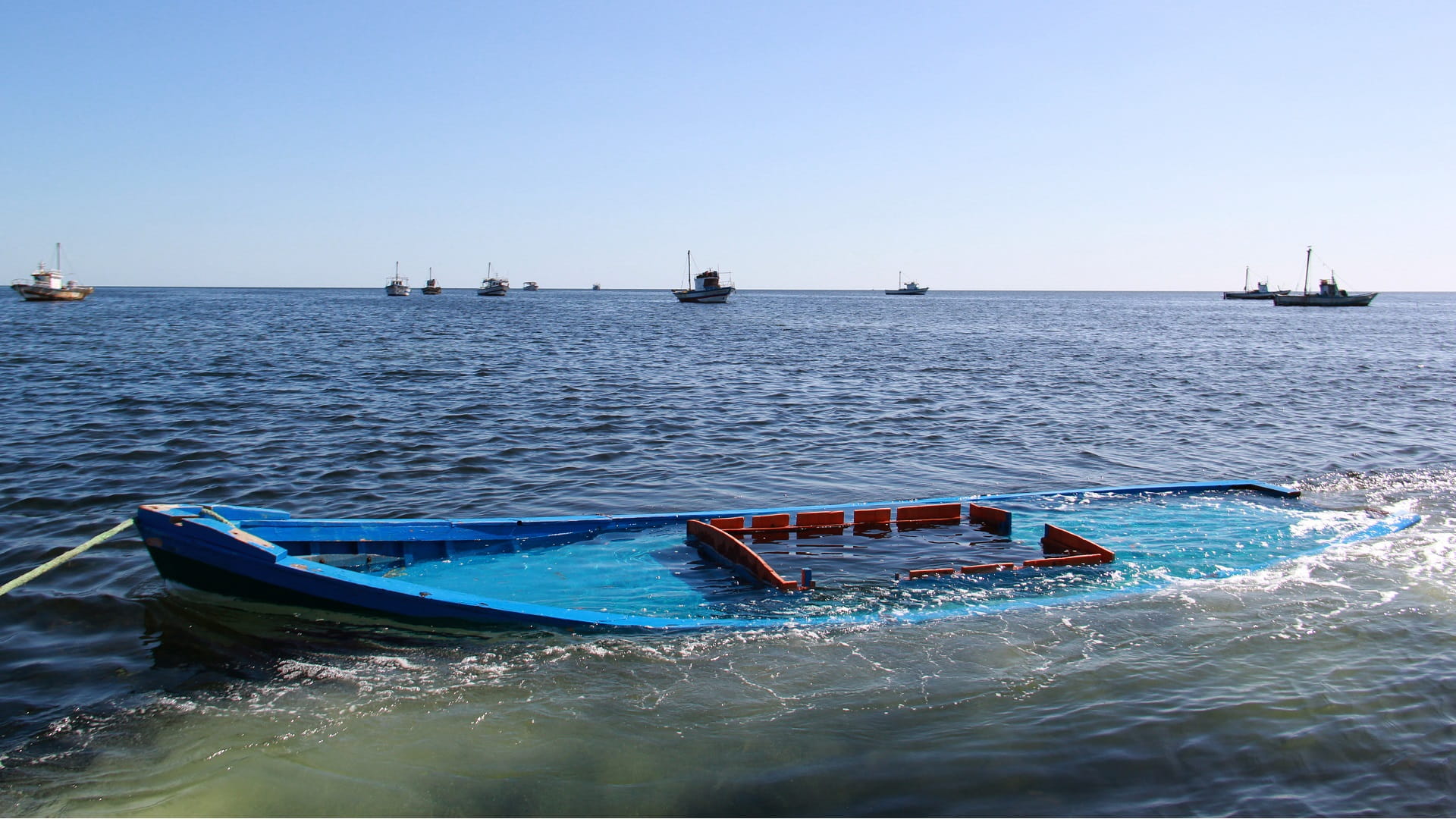 Image for the title: At least 10 migrants missing after boat sinks off Tunisia 