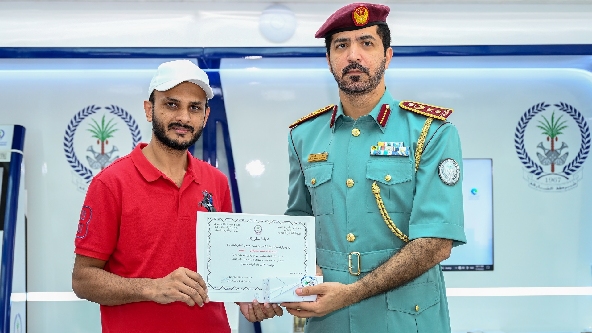 Image for the title: Sharjah Police honours man for returning lost wallet 