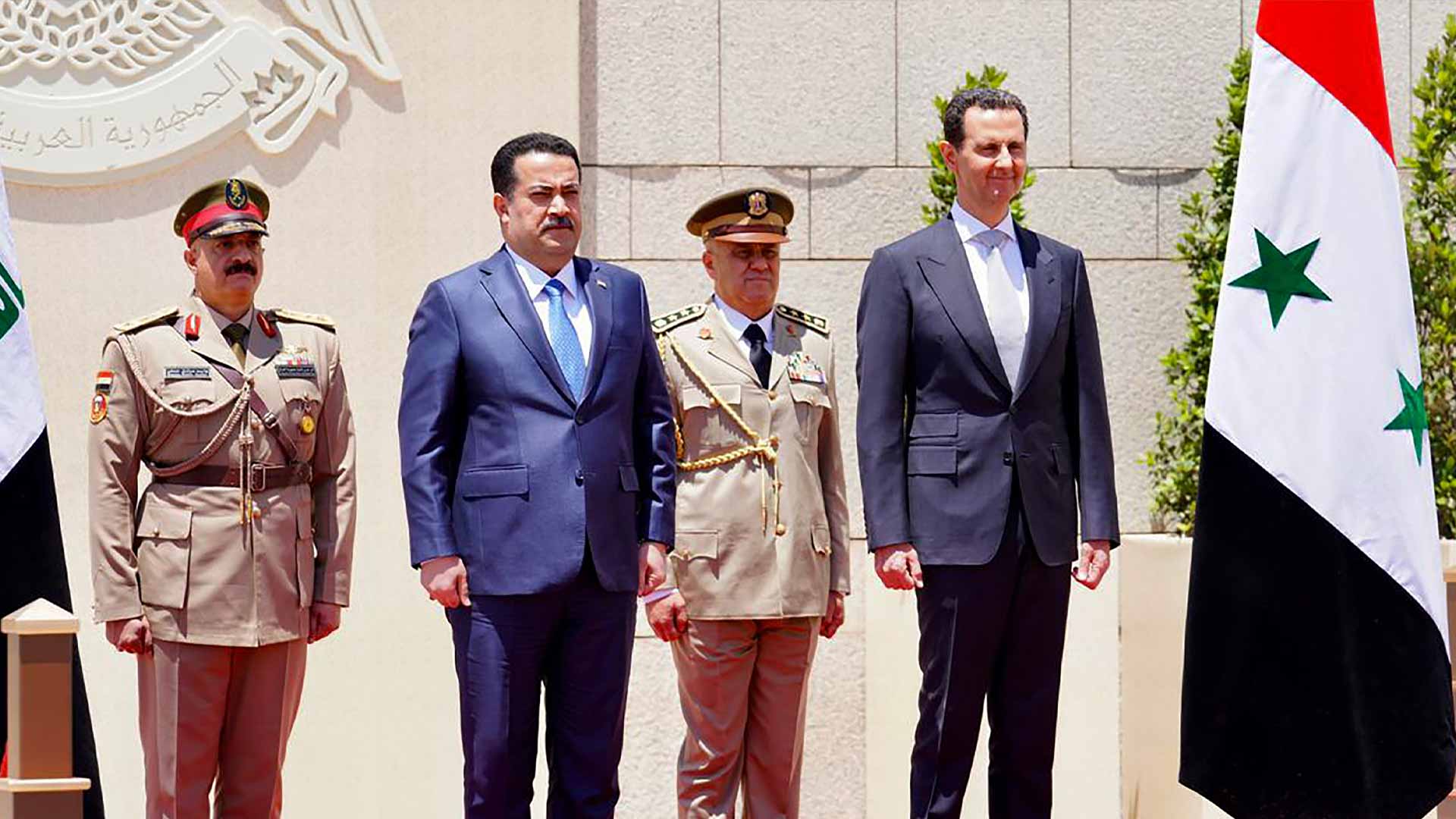 Image for the title: Iraqi PM Sudani, Syria's Assad hold talks in Damascus 