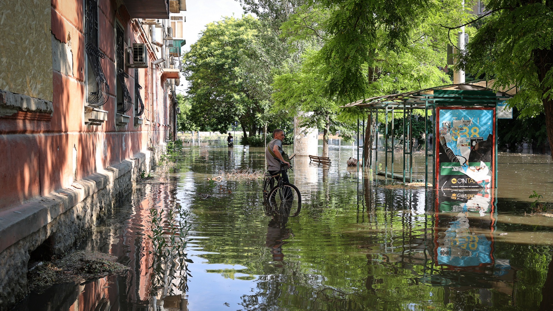 Image for the title: Ukraine evacuates thousands after key dam destroyed 