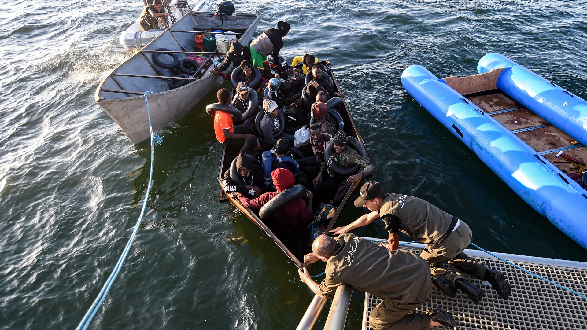 Image for the title: 12 migrants missing, 3 die after 3 boats sink off Tunisia 