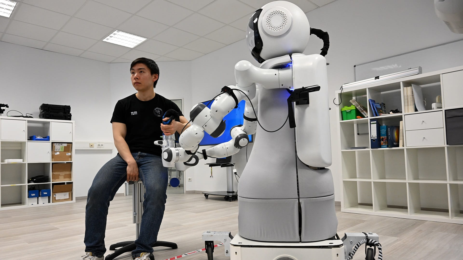 Image for the title: Lacking health workers, Germany taps robots for elder care 