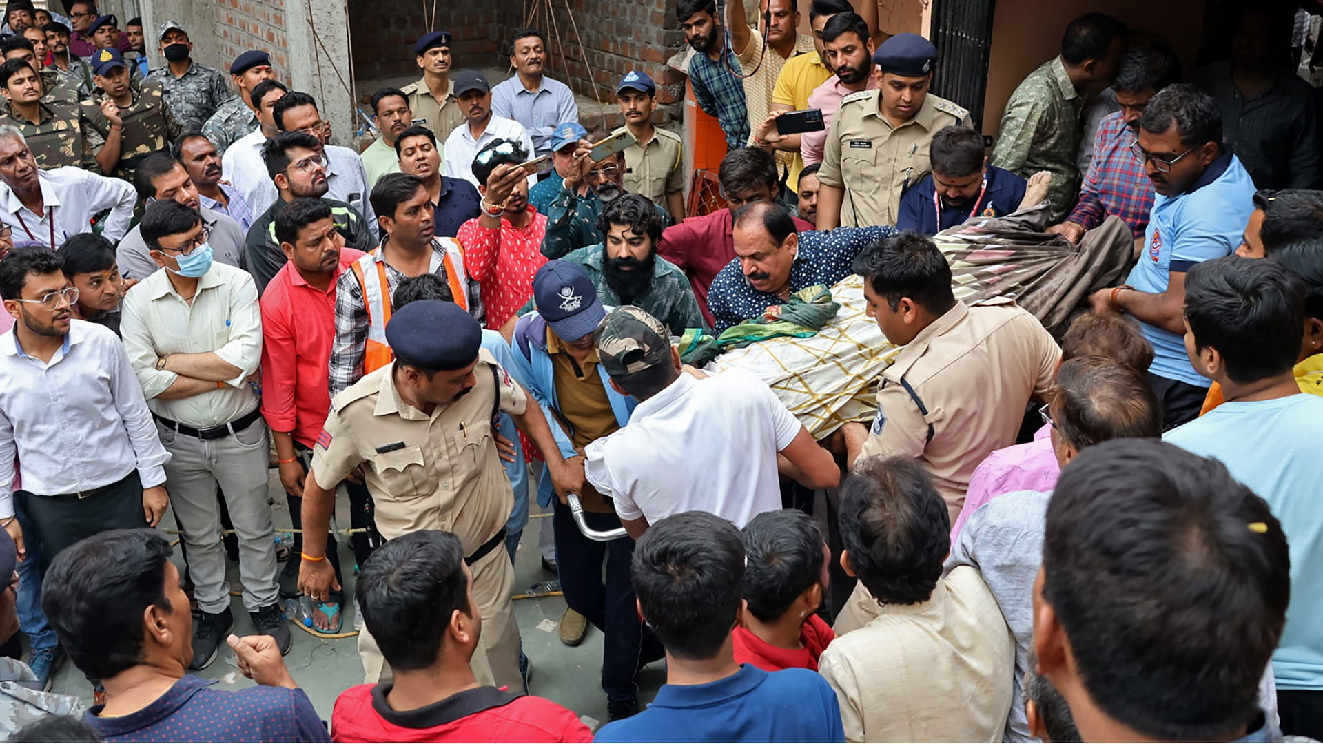 Image for the title: At least 13 killed in India temple collapse 