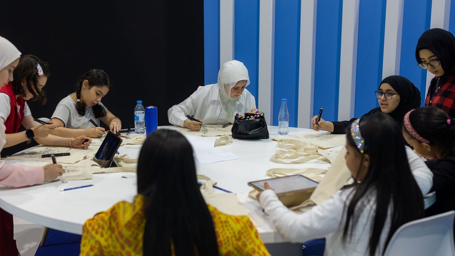 Image for the title: Young artists create personalised anime accessory bags at SCRF 