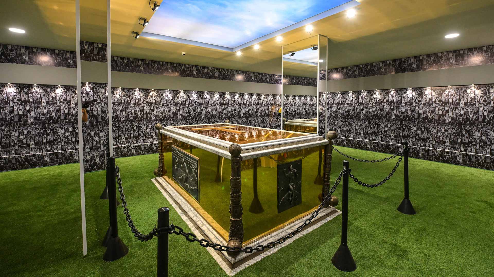 Image for the title: Brazilians may now visit Pele's golden, turf-lined mausoleum.