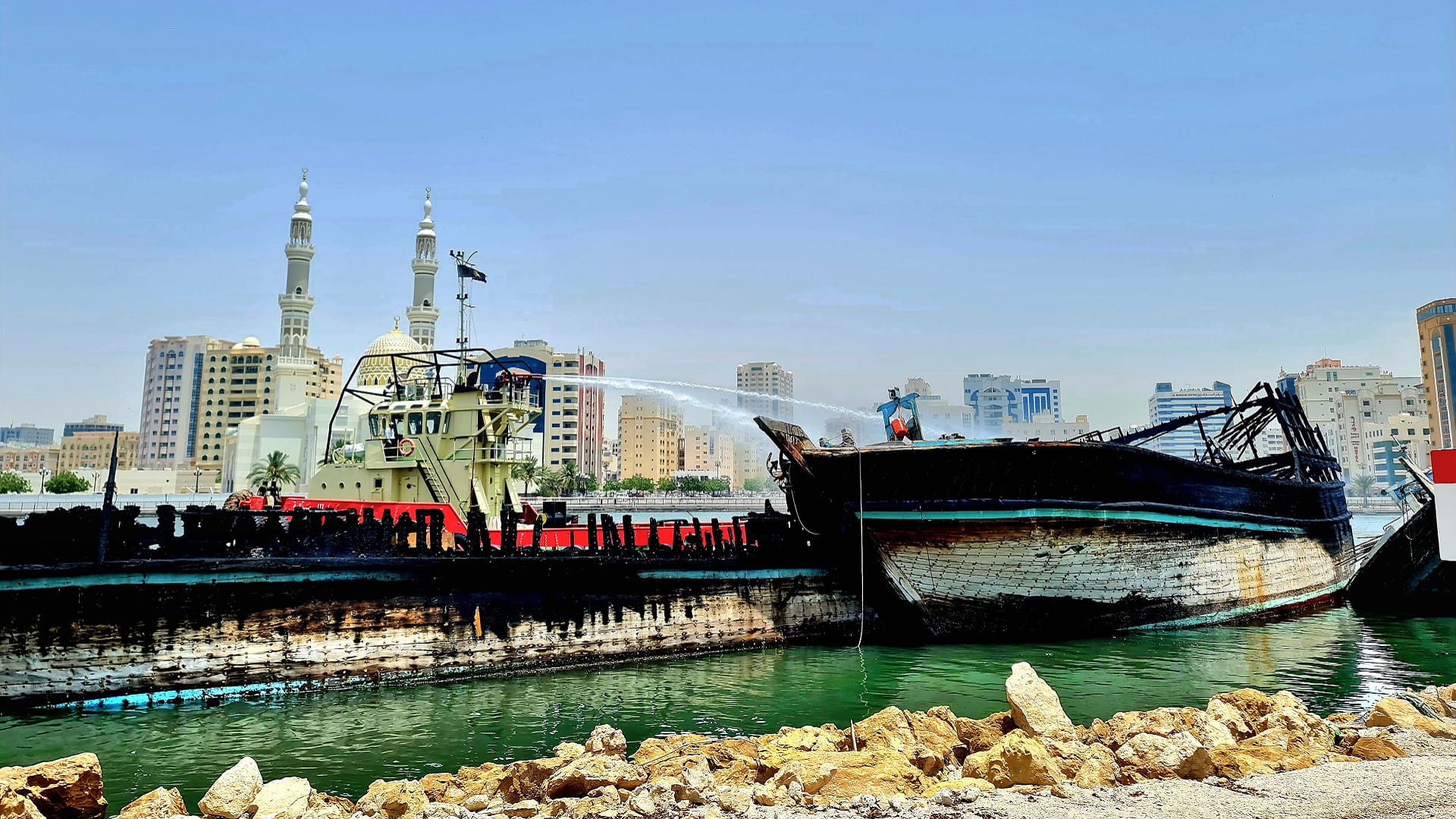 Image for the title: Sharjah firefighters put down fire at Sharjah Creek 