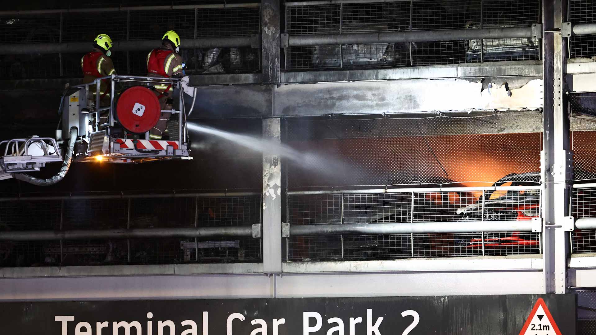 Image for the title: Luton Airport says all flights suspended due to 'significant fire'